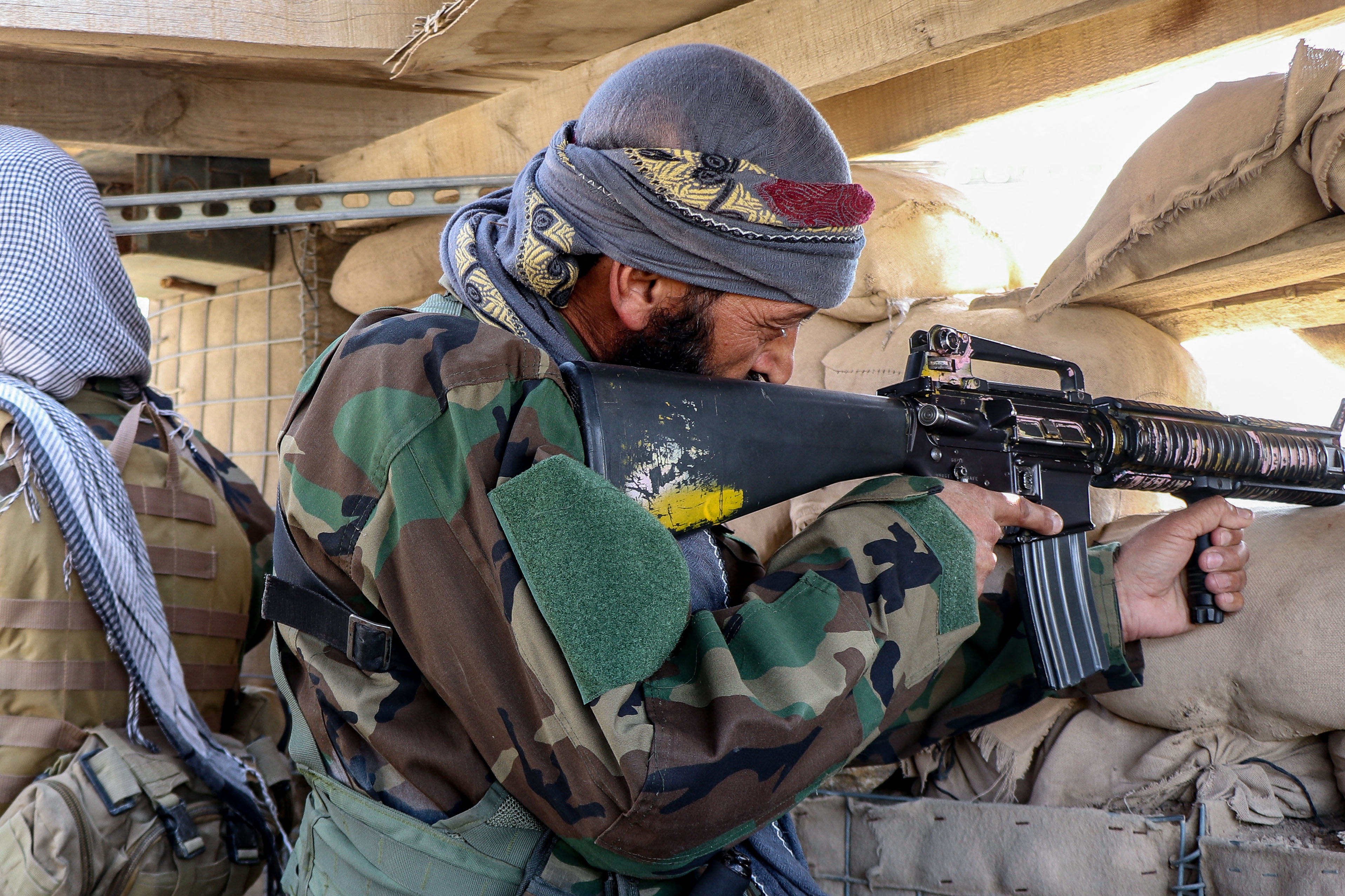 Taliban security personnel keep watch near the Durand Line