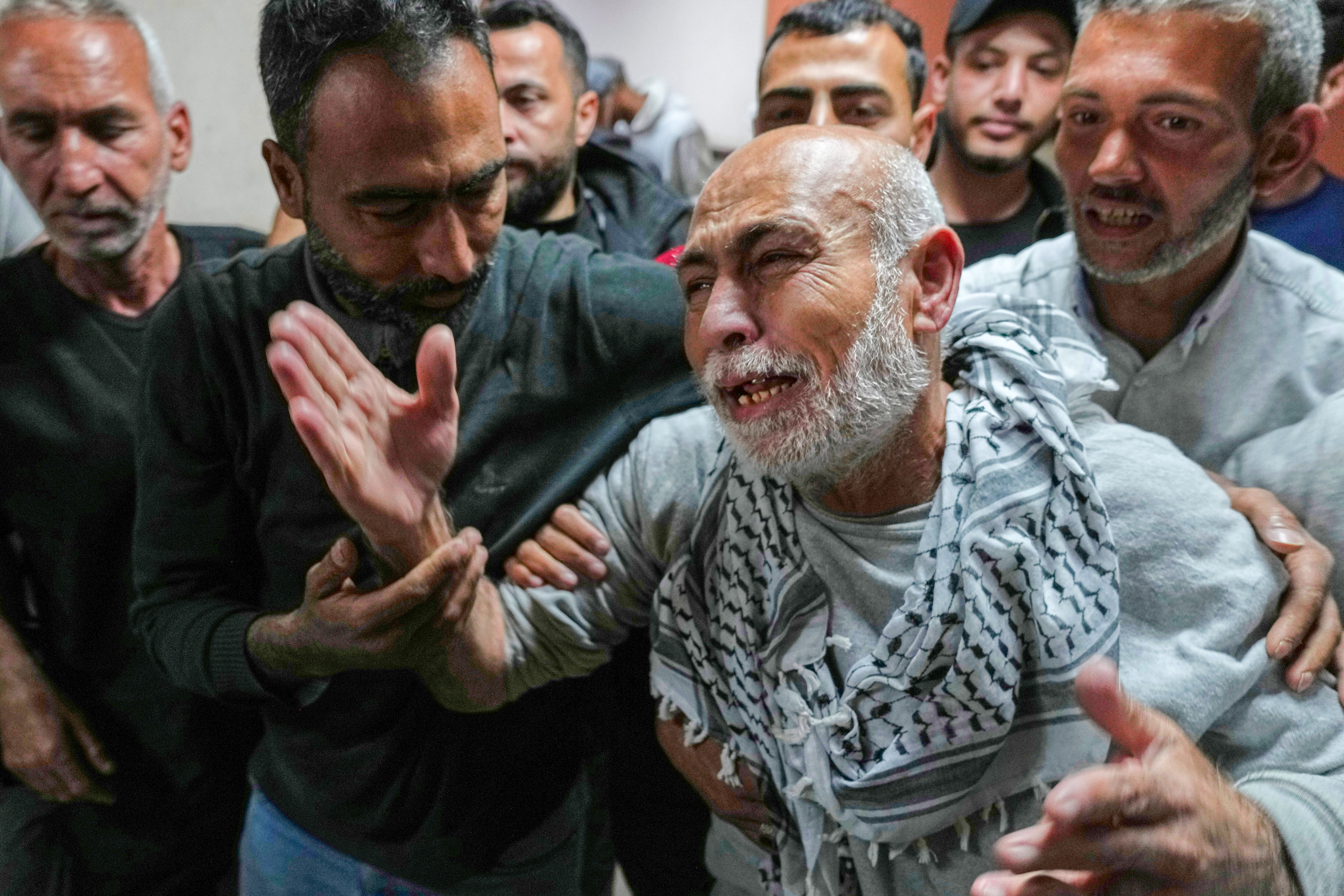 Freed Palestinian prisoner Naeim Al Burai, 66, is welcomed upon arrival at al-Aqsa Hospital in Deir al-Balah, central Gaza Strip, after being released from an Israeli prison