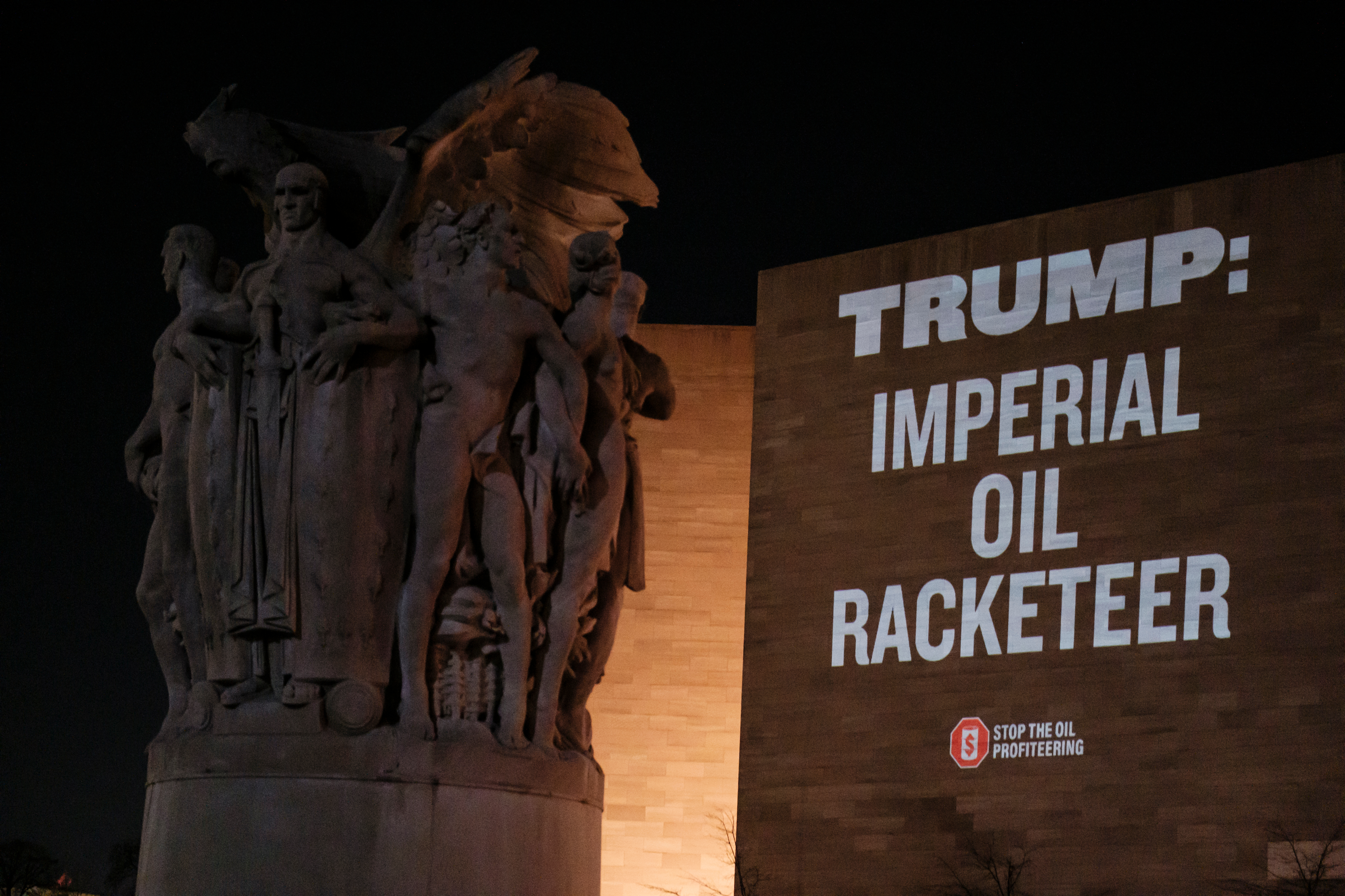Activists stage a large-scale projection opposing Trump's oil-driven intervention in Venezuela