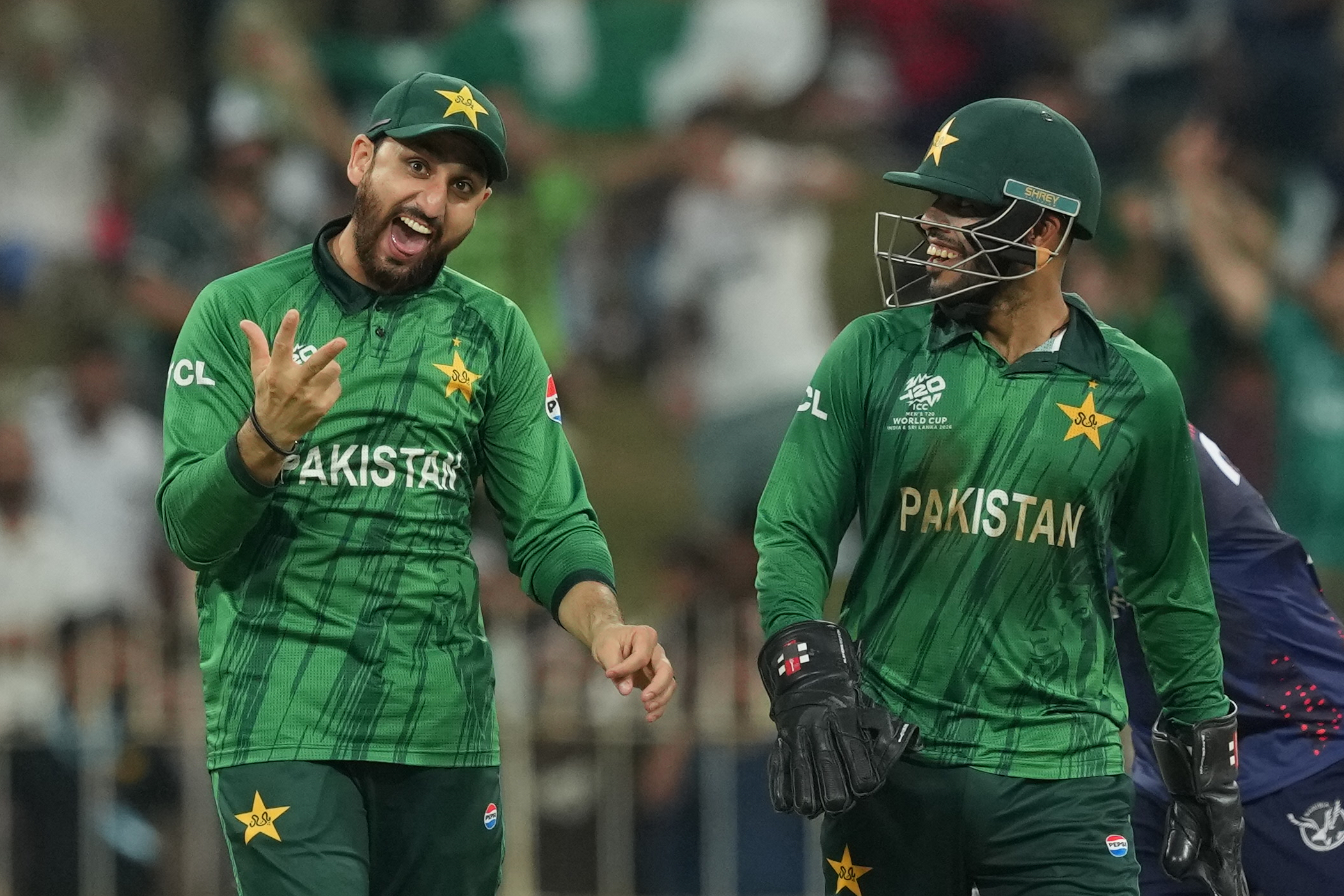Pakistan's captain Salman Ali Agha, left, celebrates with Usman Khan after winning T20 World Cup cricket match against Namibia [Eranga Jayawardena/AP Photo]