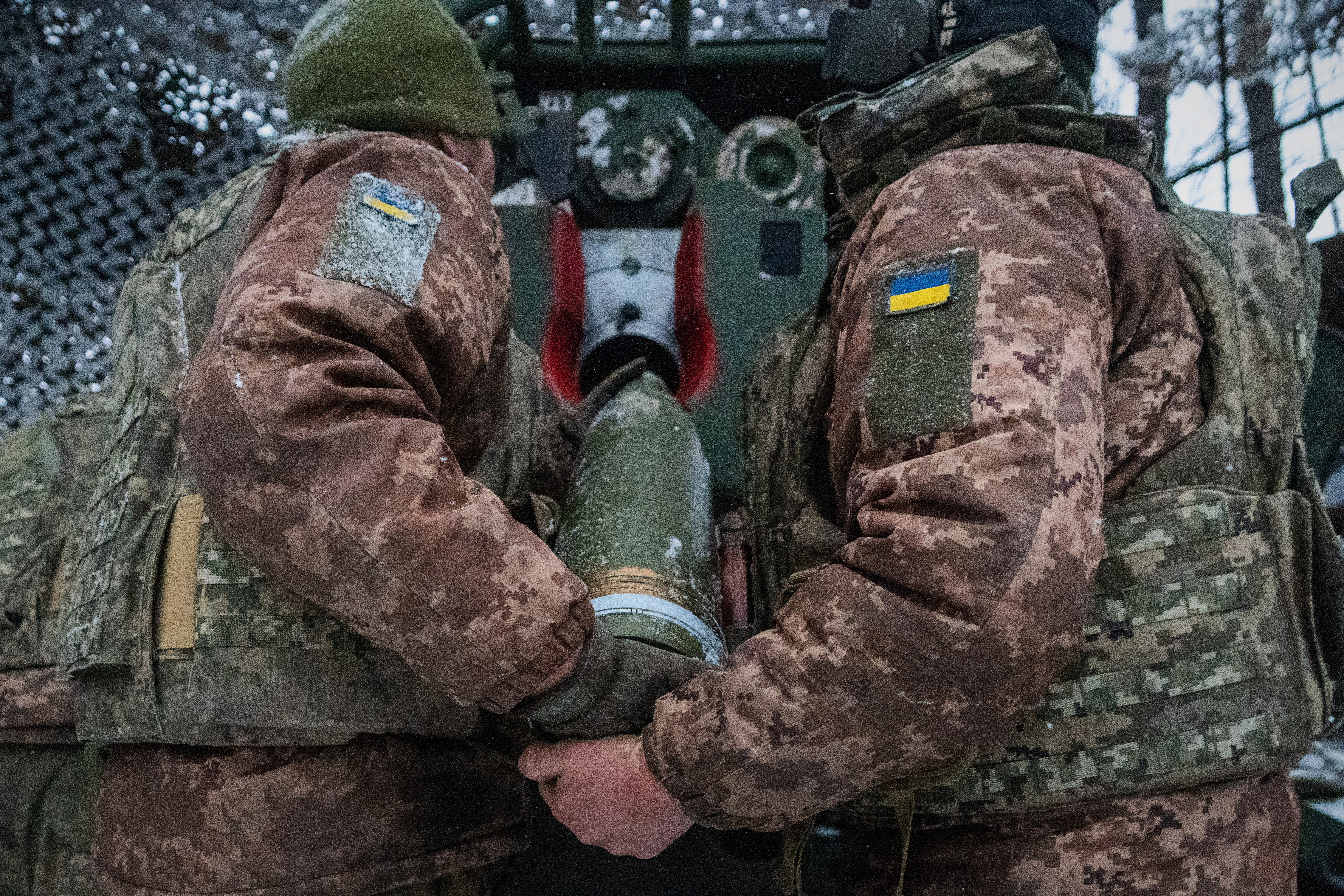 FILE - Ukrainian servicemen load an artillery shell before firing at Russian positions on the front line in Kharkiv region of Ukraine, Wednesday, Feb. 18, 2026. (AP Photo/Andrii Marienko, File)