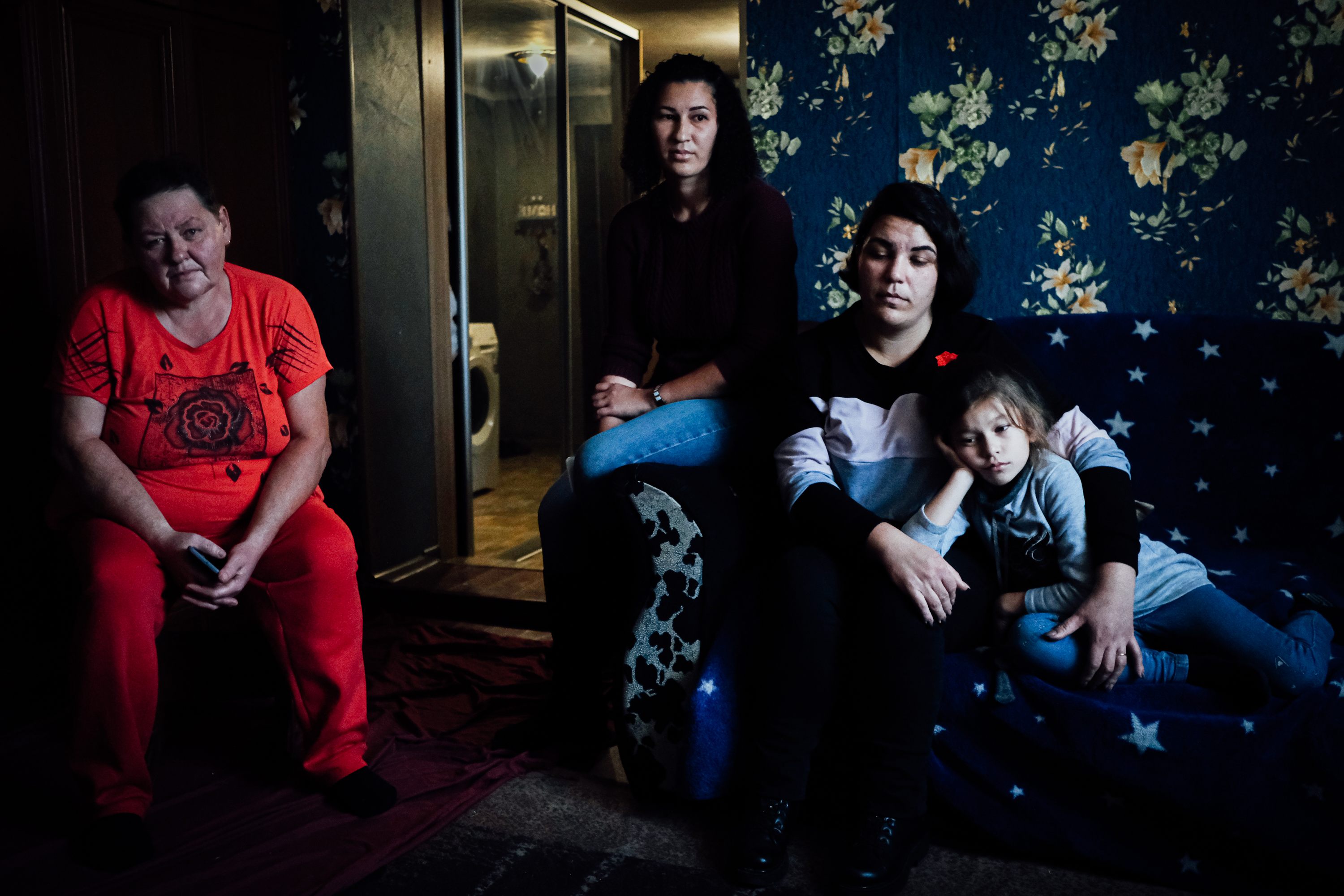 A family who had two male relatives taken by Russian forces, when Bucha, near Kyiv, was occupied in the first months of the full-scale invasion
