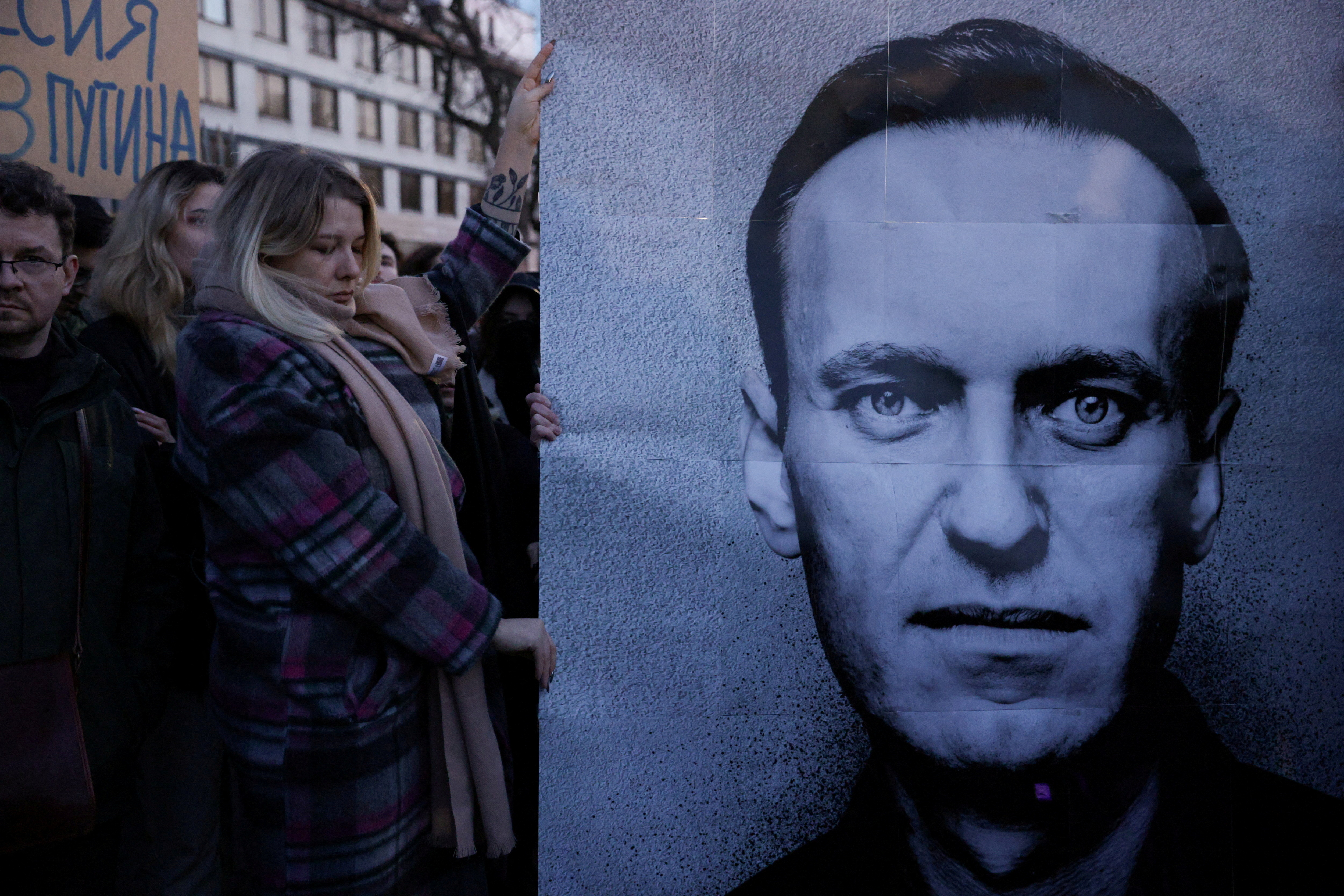 People gather outside the Russian embassy in Poland, following the death of Alexey Navalny