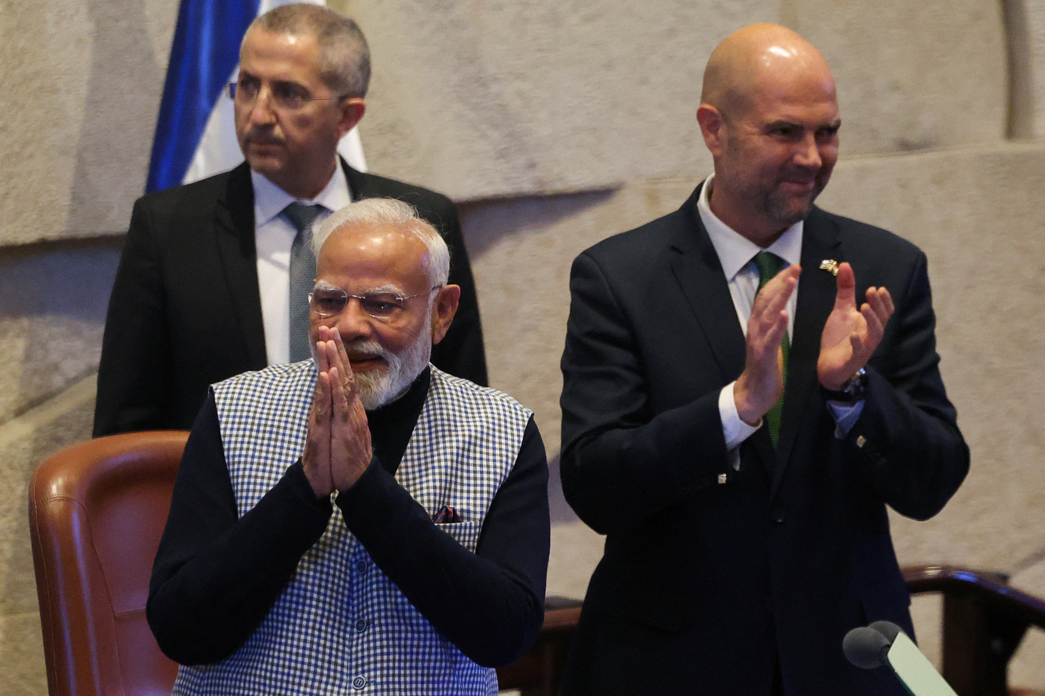 India's Prime Minister Narendra Modi stands next to Amir Ohana, speaker of the Knesset, as Prime Minister Modi attends a special session of the Knesset, Israel's parliament, in Jerusalem February 25, 2026. REUTERS/Ronen Zvulun