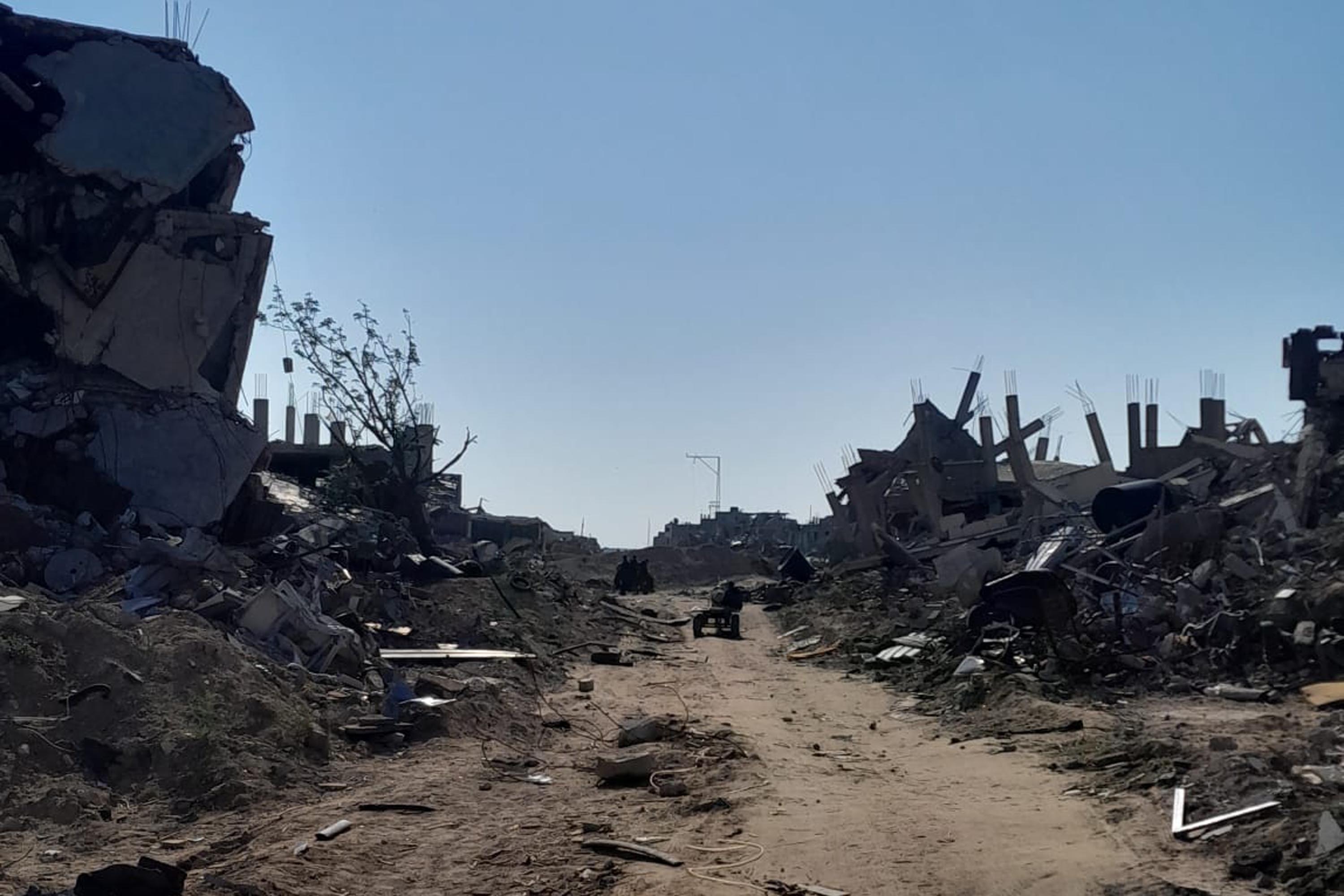 A photo showing a road and rubble on both sides