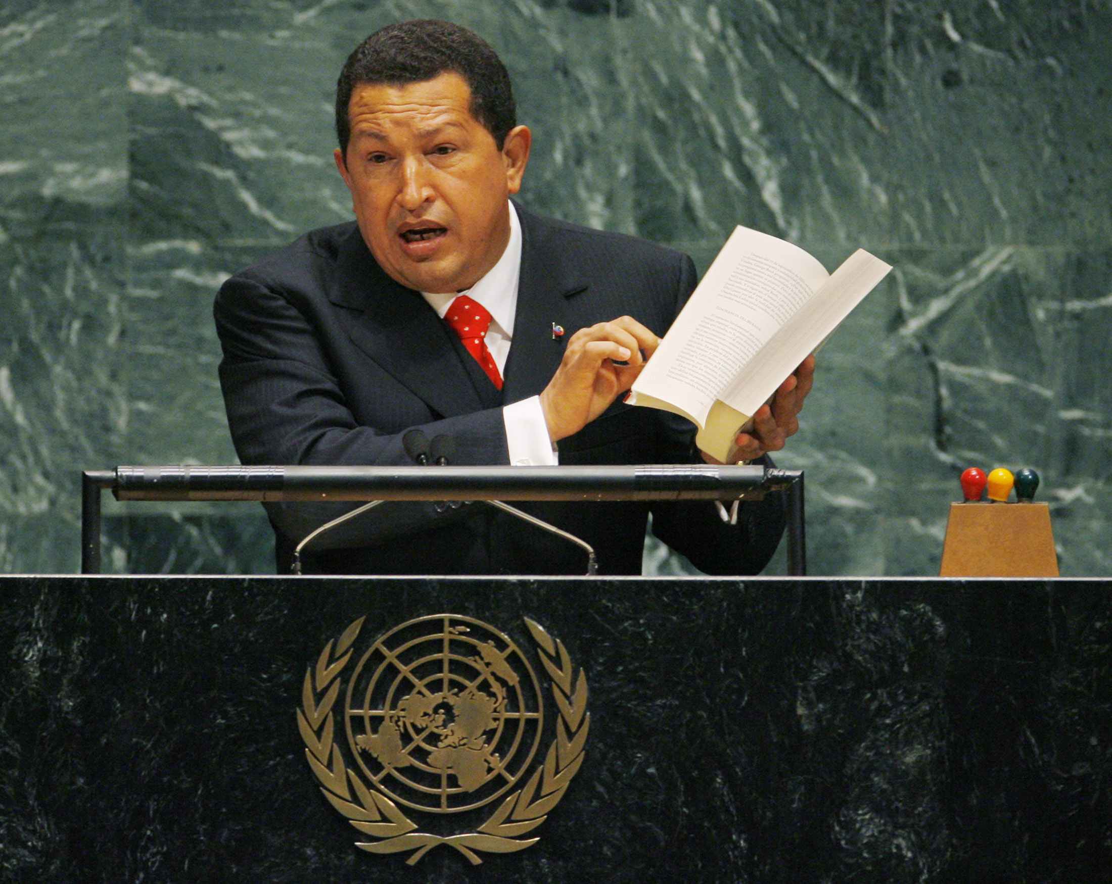 Venezuela's President Hugo Chavez displays author Noam Chomsky's book: