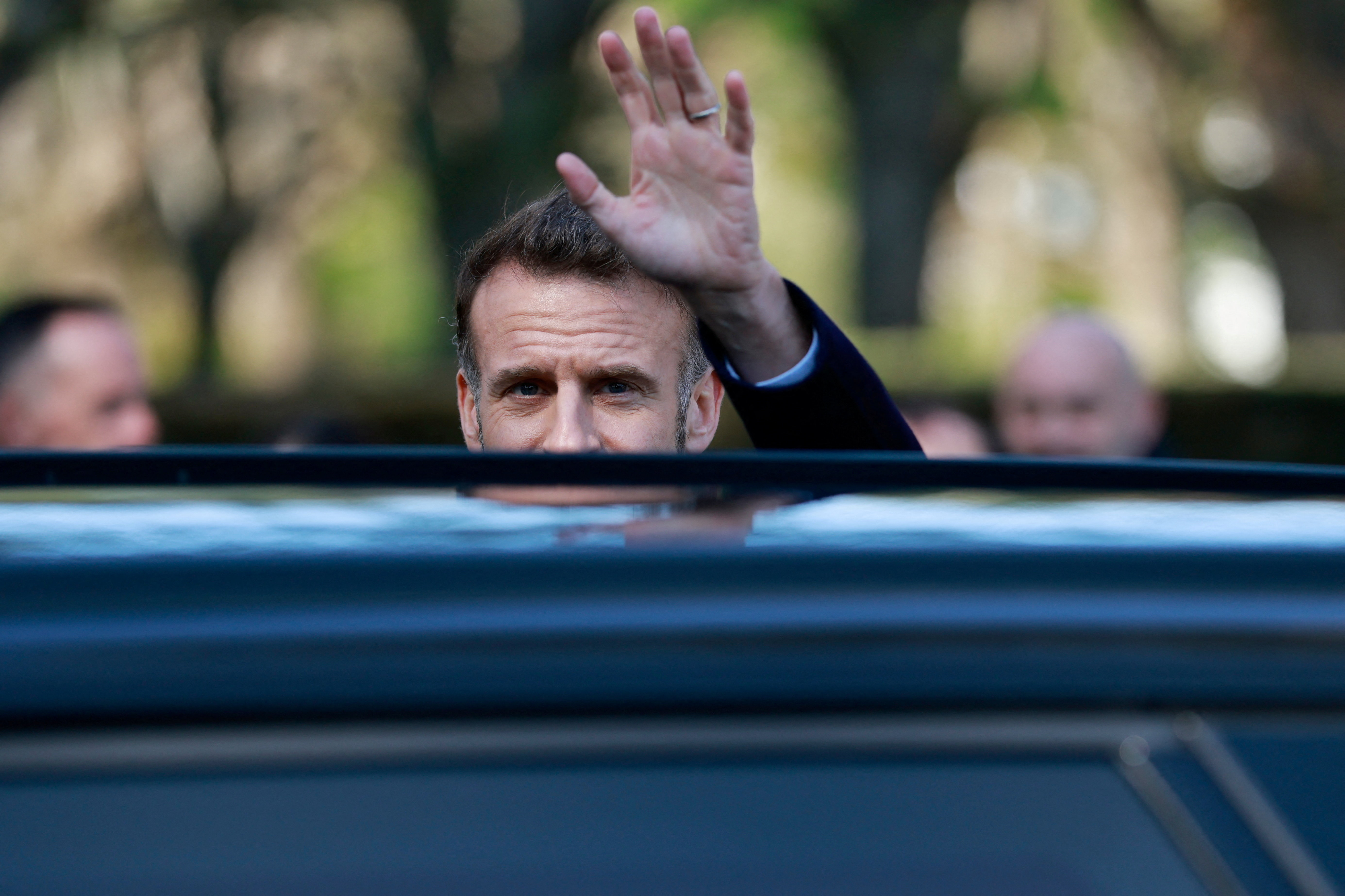 French President Emmanuel Macron waves to bystanders as he leaves a polling station during the first round of France's municipal elections in Le Touquet-Paris-Plage, France, Sunday, March 15, 2026. Jean-Francois Badias/Pool via REUTERS