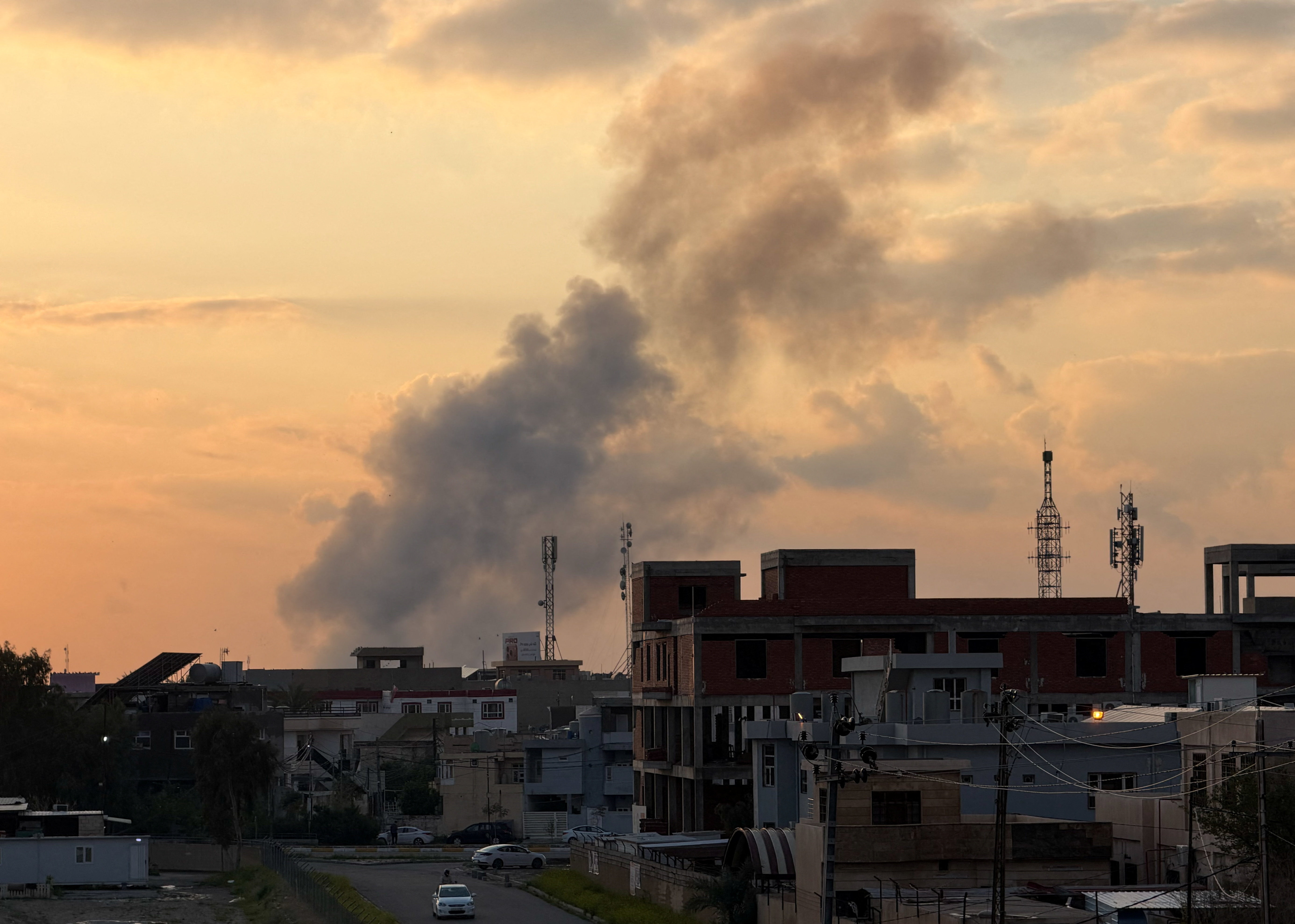 Smoke rises following an airstrike on a Popular Mobilisation Forces (PMF) headquarters at Kirkuk International Airport
