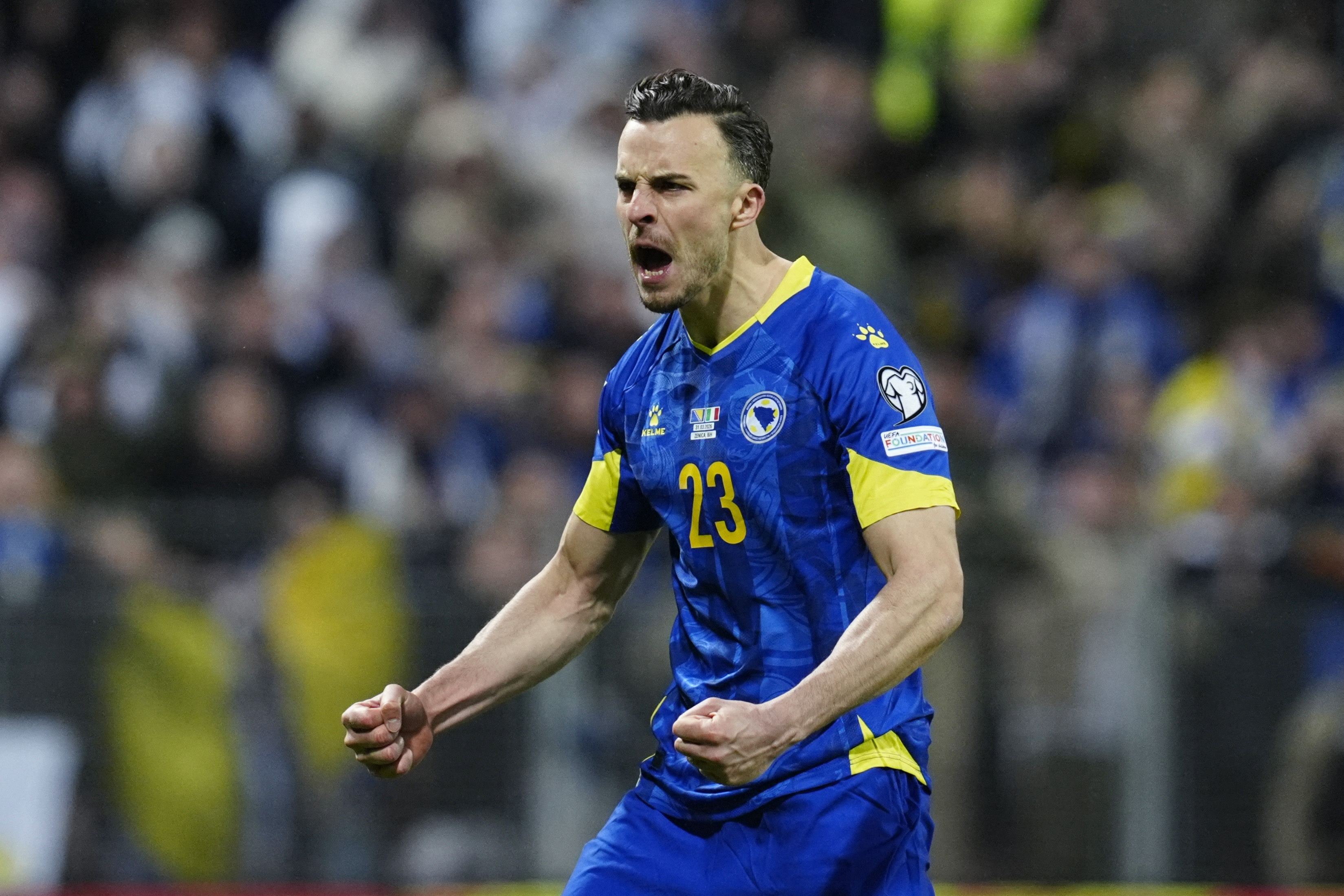 Bosnia and Herzegovina's Haris Tabakovic celebrates scoring a penalty during the penalty shootout