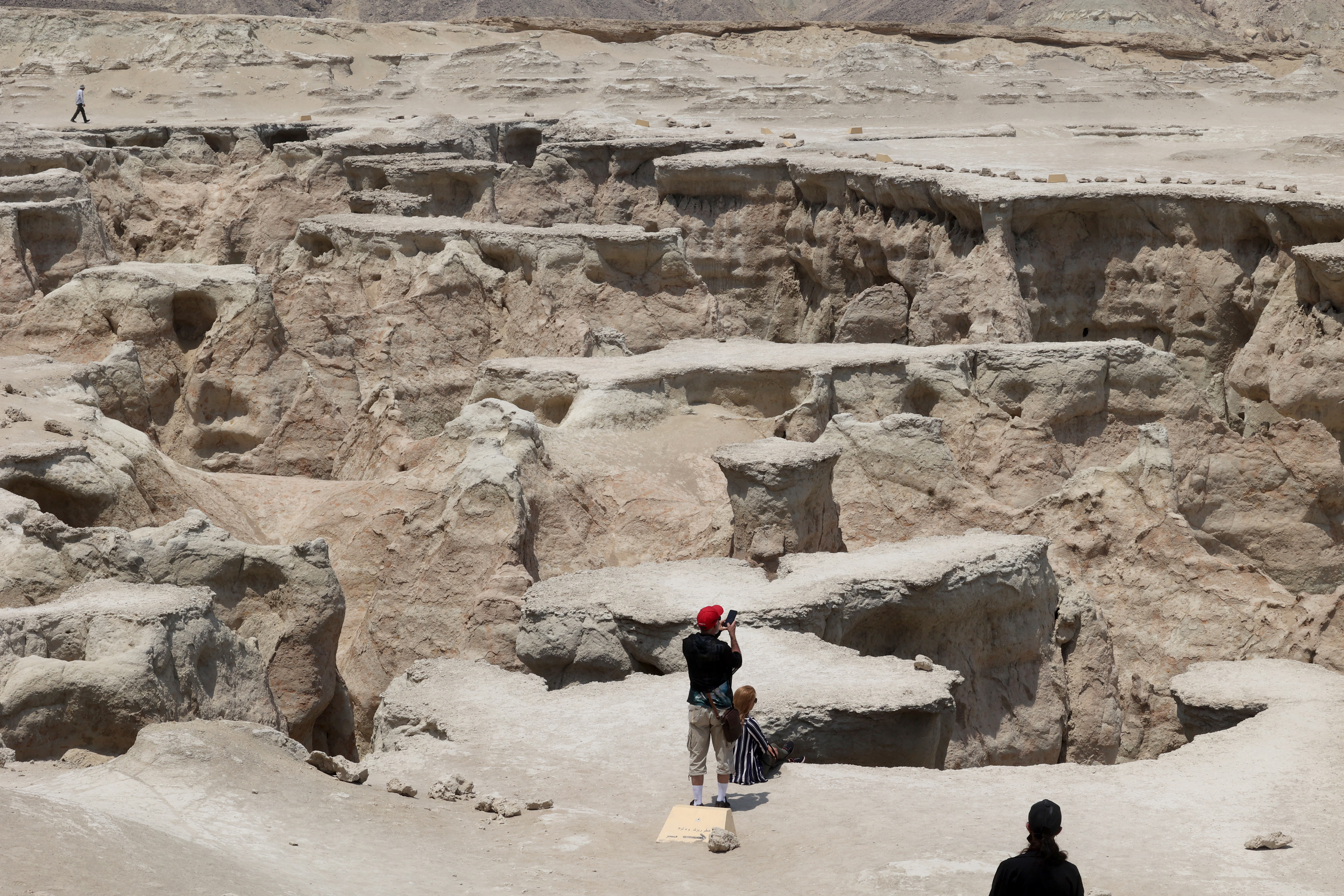 Tourists visit Star Valley, one of the sightseeing centres on Qeshm island in the Gulf off Iran's southern coast, on May 1, 2023. The island hopes tax exemptions and other special import and export regulations introduced by the Islamic republic would attract Iranian tourists to its shopping centres, offering foreign products from chocolates to designer clothes. (Photo by ATTA KENARE / AFP)