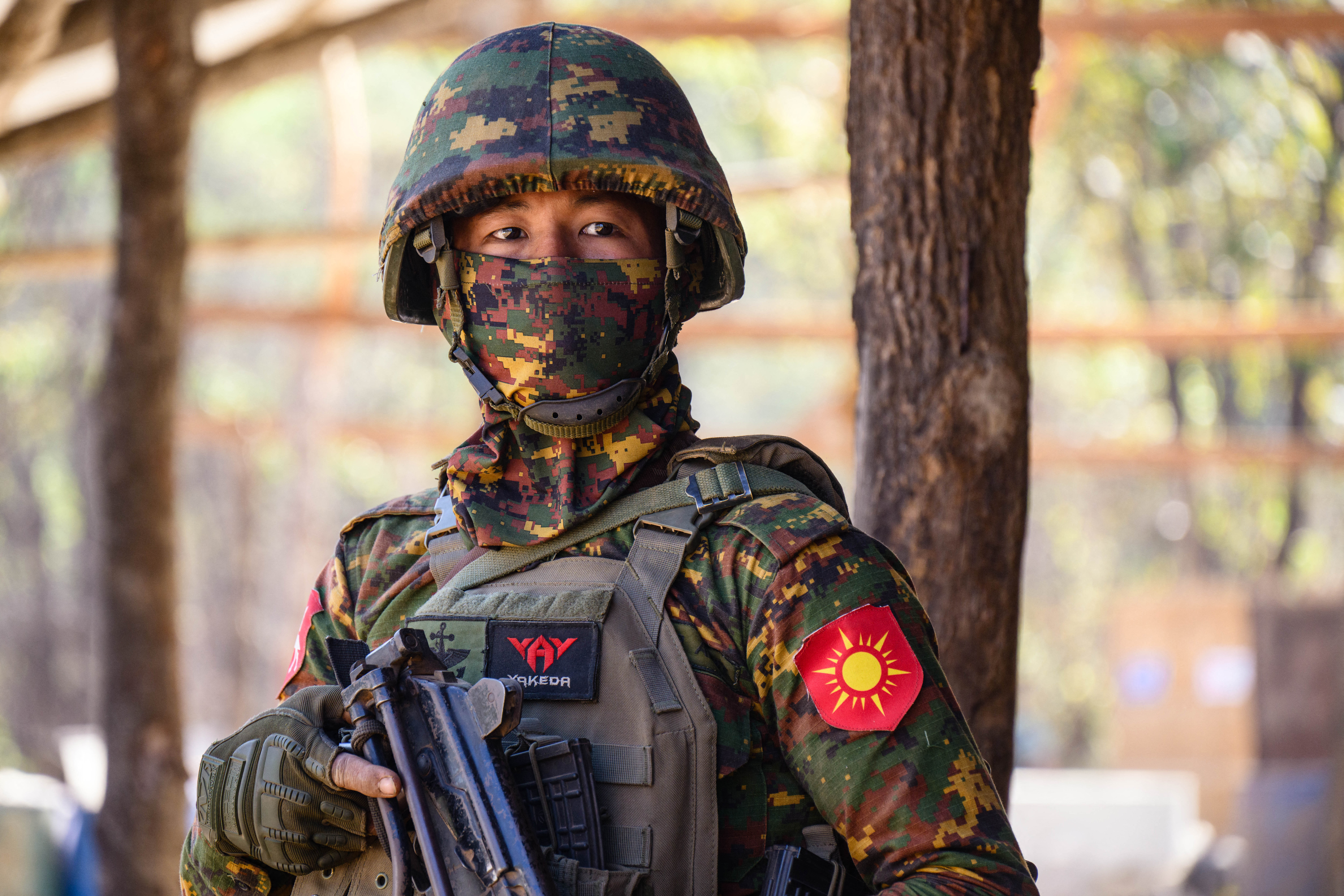 In this photo taken on January 24, 2026, a soldier stands guard during a press tour at a drug production site southwest of Mongyai, northern Shan State, that was captured by the Myanmar military. The Southeast Asian country has long been a hive for illegal drug trade, but analysts say the civil war triggered by a 2021 military coup has increased production and trafficking. (Photo by ANTHONY WALLACE / AFP)