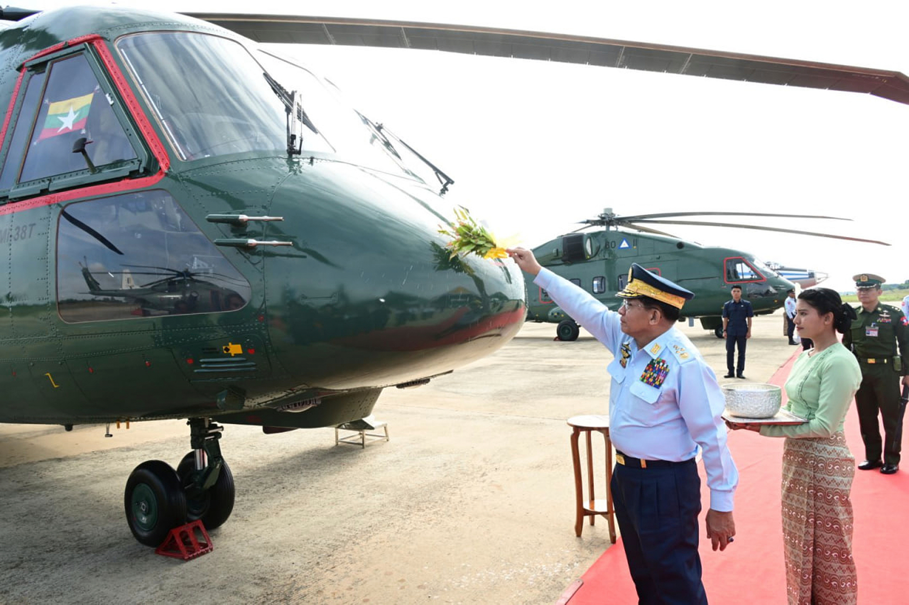 In this photo provided by the the Myanmar Military True News Information Team, head of the ruling military government, Senior Gen. Min Aung Hlaing attends a ceremony to commission new Russian helicopters and Chinese airplanes into its air force in Naypyitaw, Myanmar on Nov. 7, 2025. (The Myanmar Military True News Information Team via AP)
