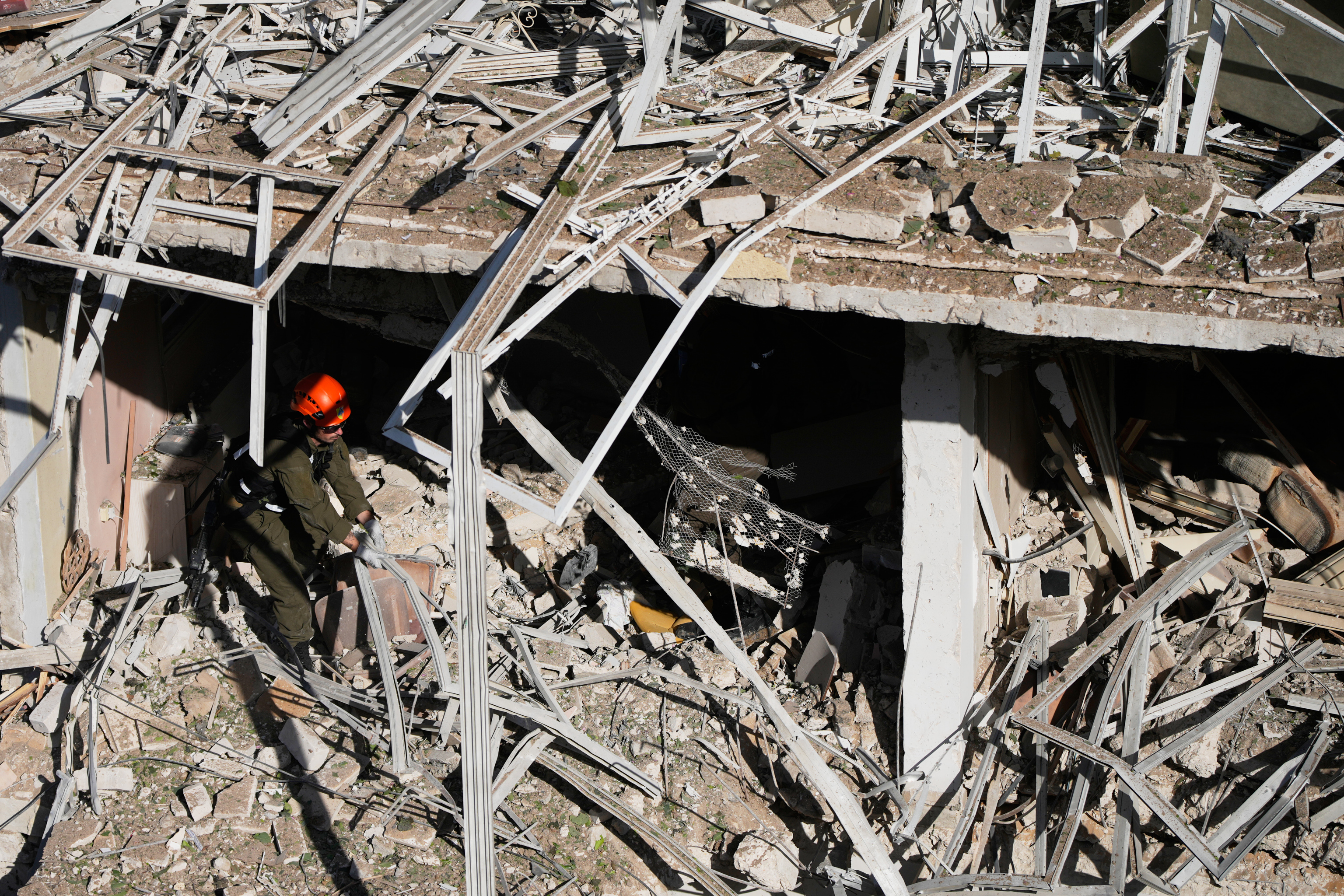This picture shows damaged buildings at the site of an Iranian missile strike in Tel Aviv