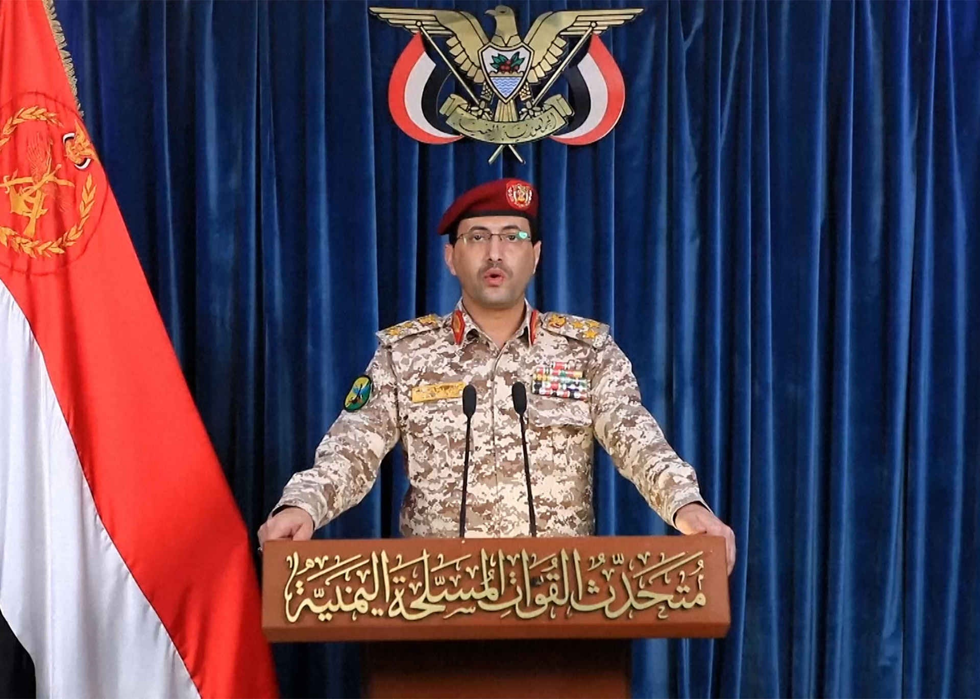 Houthi Military Spokesman Brigadier General Yahya Saree speaks in a video message from Sanaa, Yemen. [Al-Masirah TV via AP]