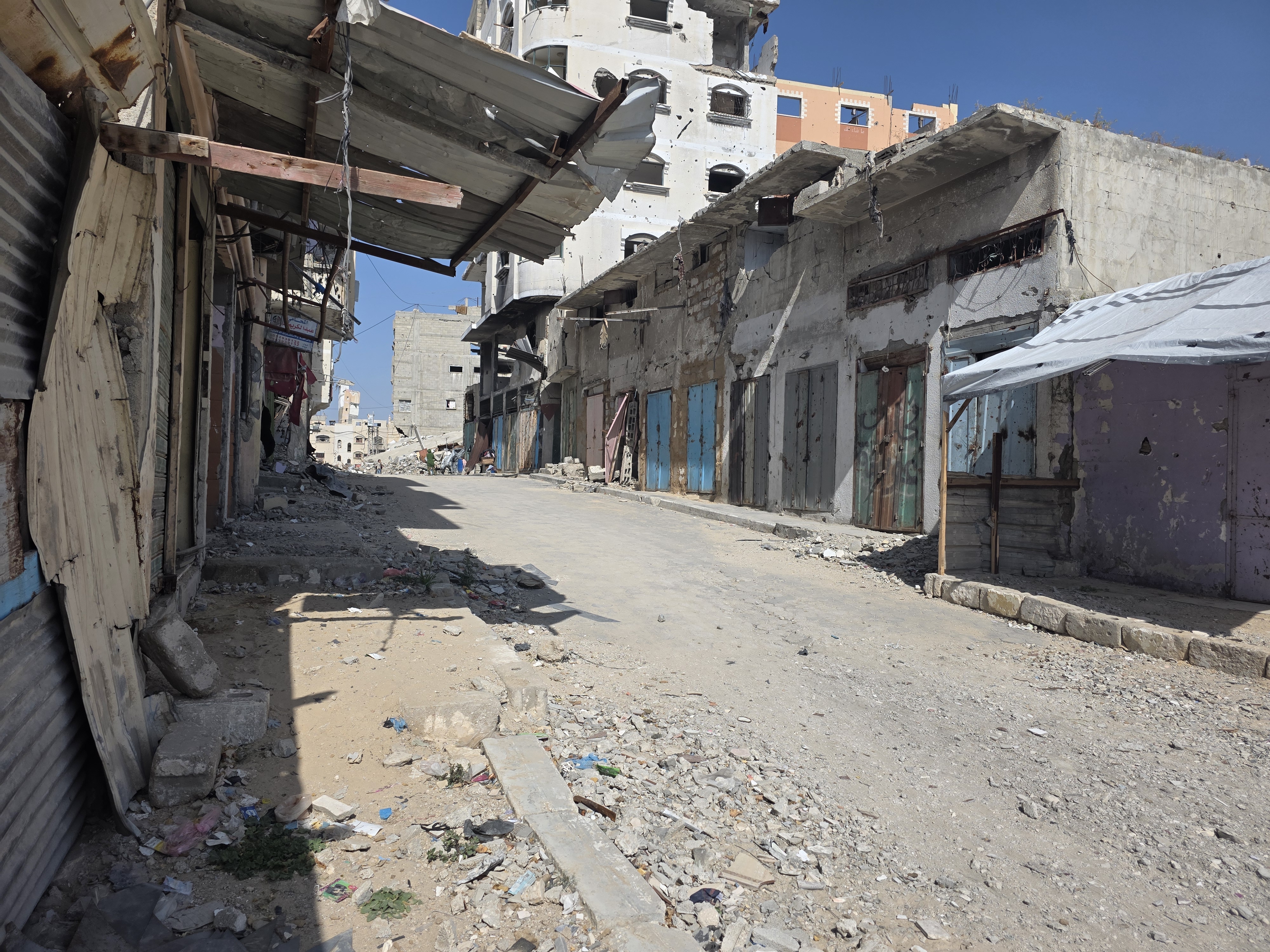 Rows of damaged and closed shops in Khan Younis’s Grain Market