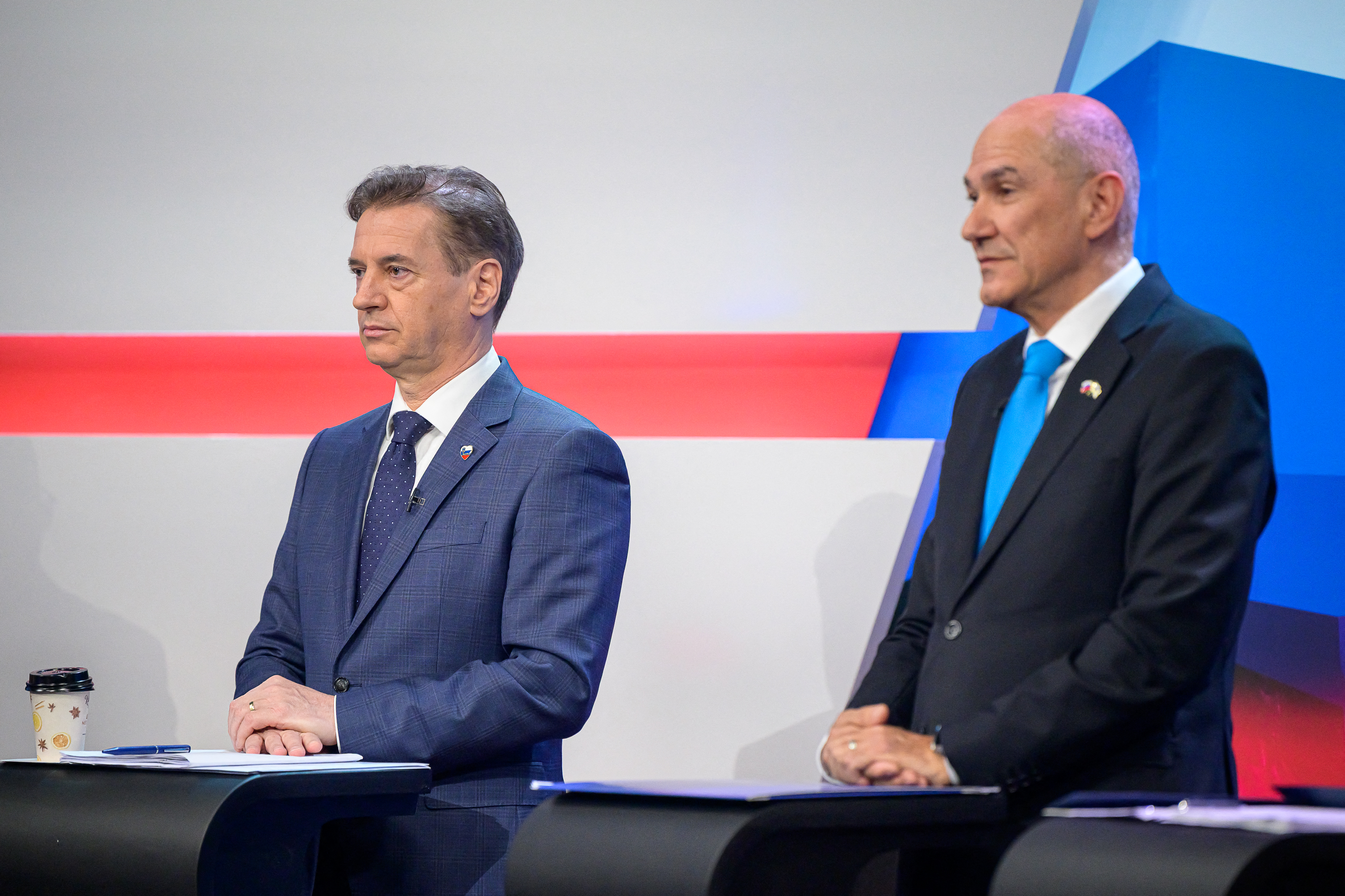 Slovenia's Prime Minister Robert Golob (L) and Slovenia's opposition leader and nationalist former Prime Minister Janez Jansa attend the last televised political debate ahead of the parliamentary elections in Ljubljana on March 20, 2026.