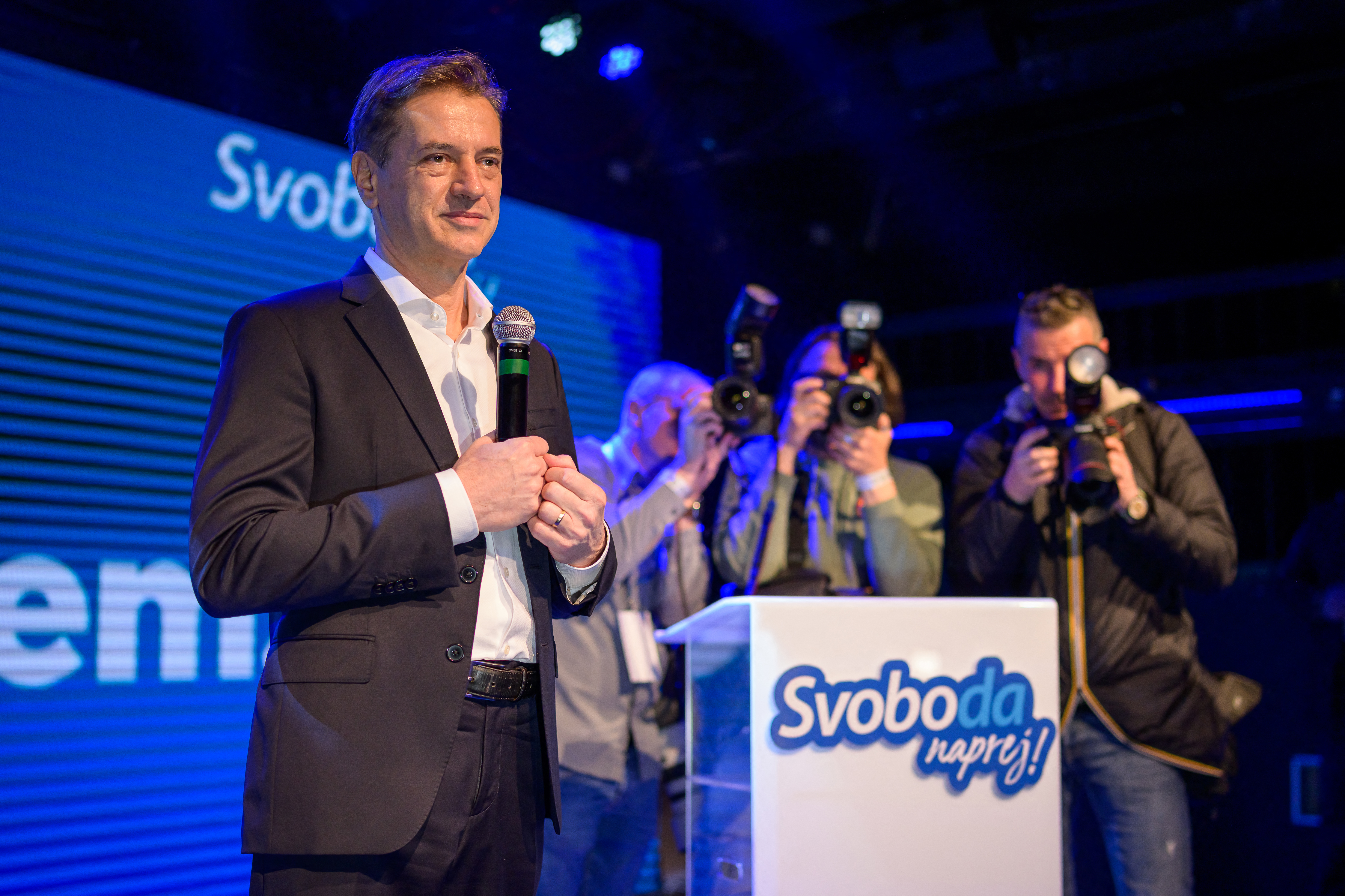 Slovenia’s Prime Minister Robert Golob (L) addresses the supporters of Gibanje Svoboda (The Freedom Movement) after the General Elections results are released in Ljubljana, Slovenia, on March 22, 2026.
