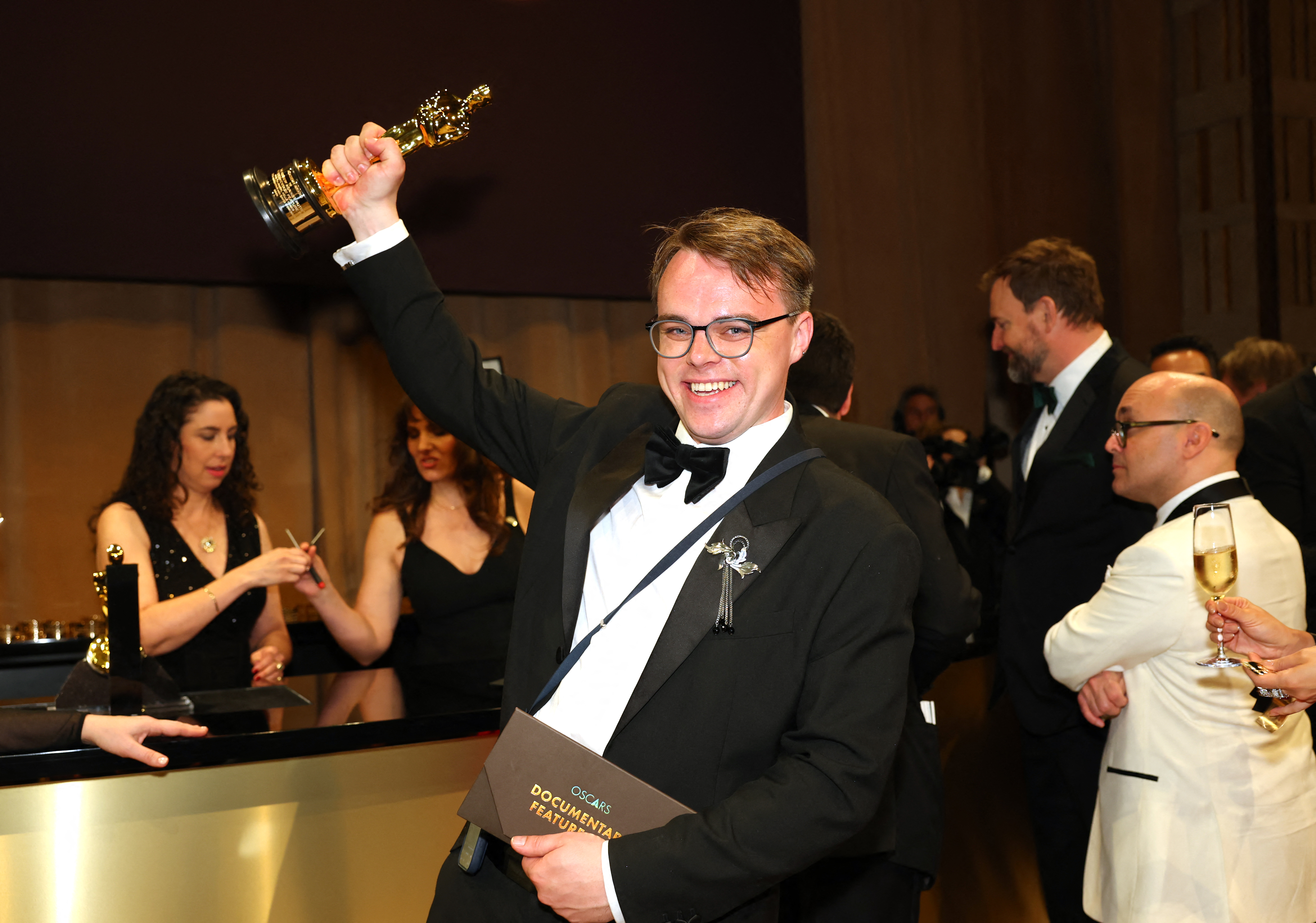 (FILES) Russian teacher Pavel Talankin hoists his Oscar for Best Documentary Feature Film for "Mr. Nobody Against Putin" at the 98th Annual Academy Awards Governors Ball at the Dolby Theatre in Hollywood, California on March 15, 2026.