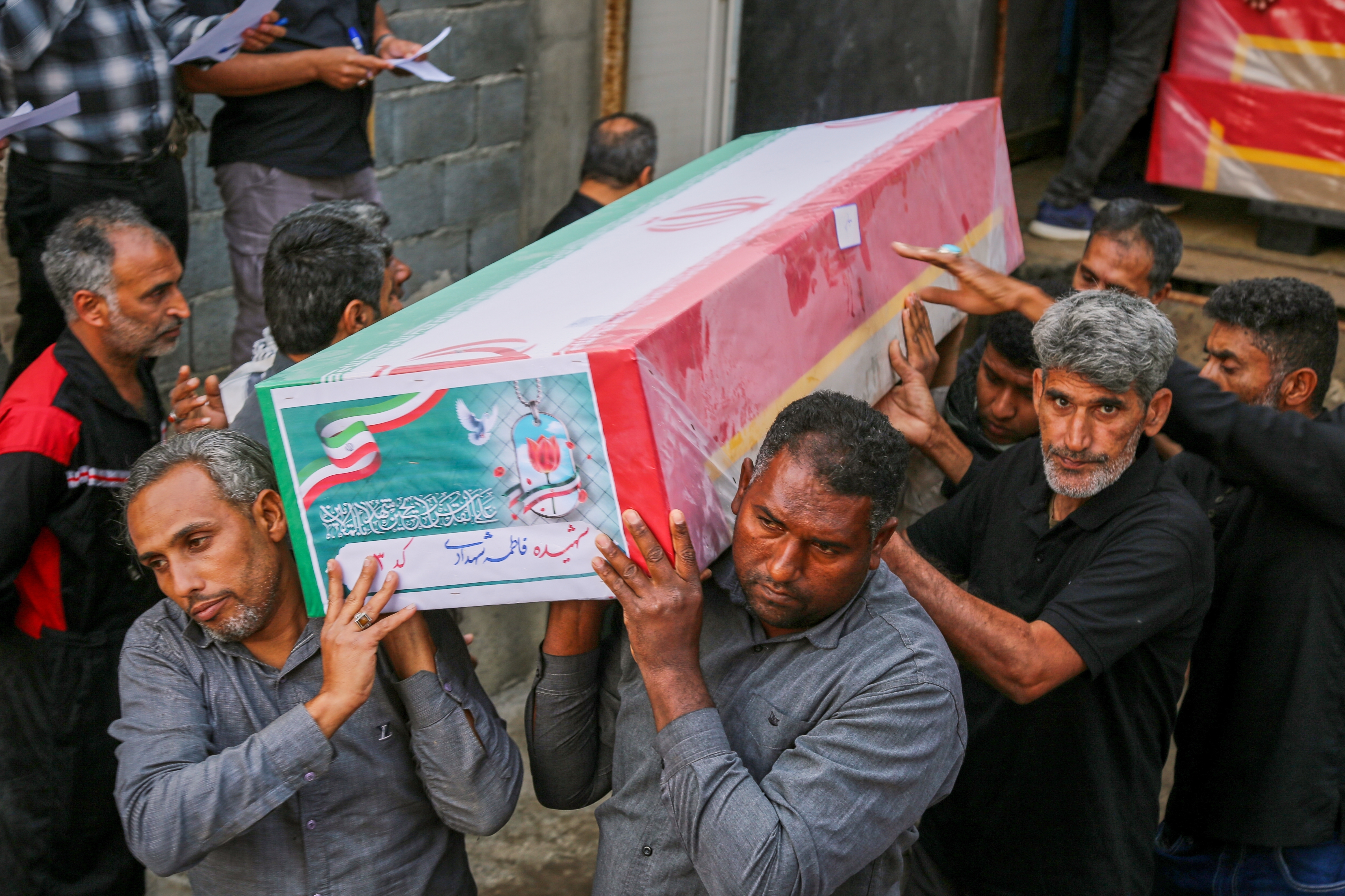 A coffin is carried during the funeral of mostly children killed in what Iranian officials said was an Israeli-U.S. strike Feb. 28 at a girls' elementary school in Minab, Iran, Tuesday, March 3, 2026. (Abbas Zakeri/Mehr News Agency via AP)
