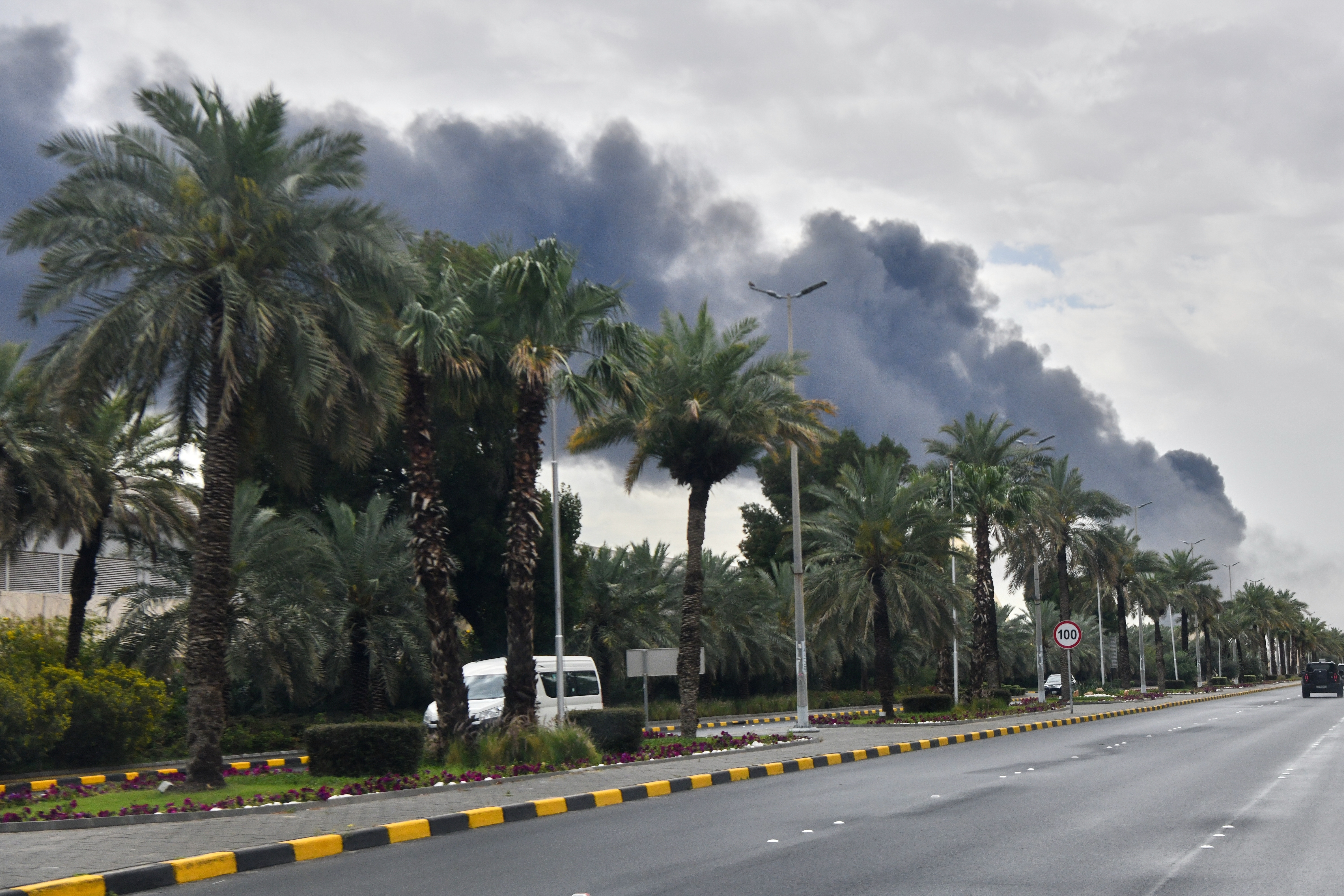Smoke rises from Kuwait international airport after a drone strike on fuel storage in Kuwait City, Kuwait, Friday, Wednesday, March 25, 2026. (AP Photo)