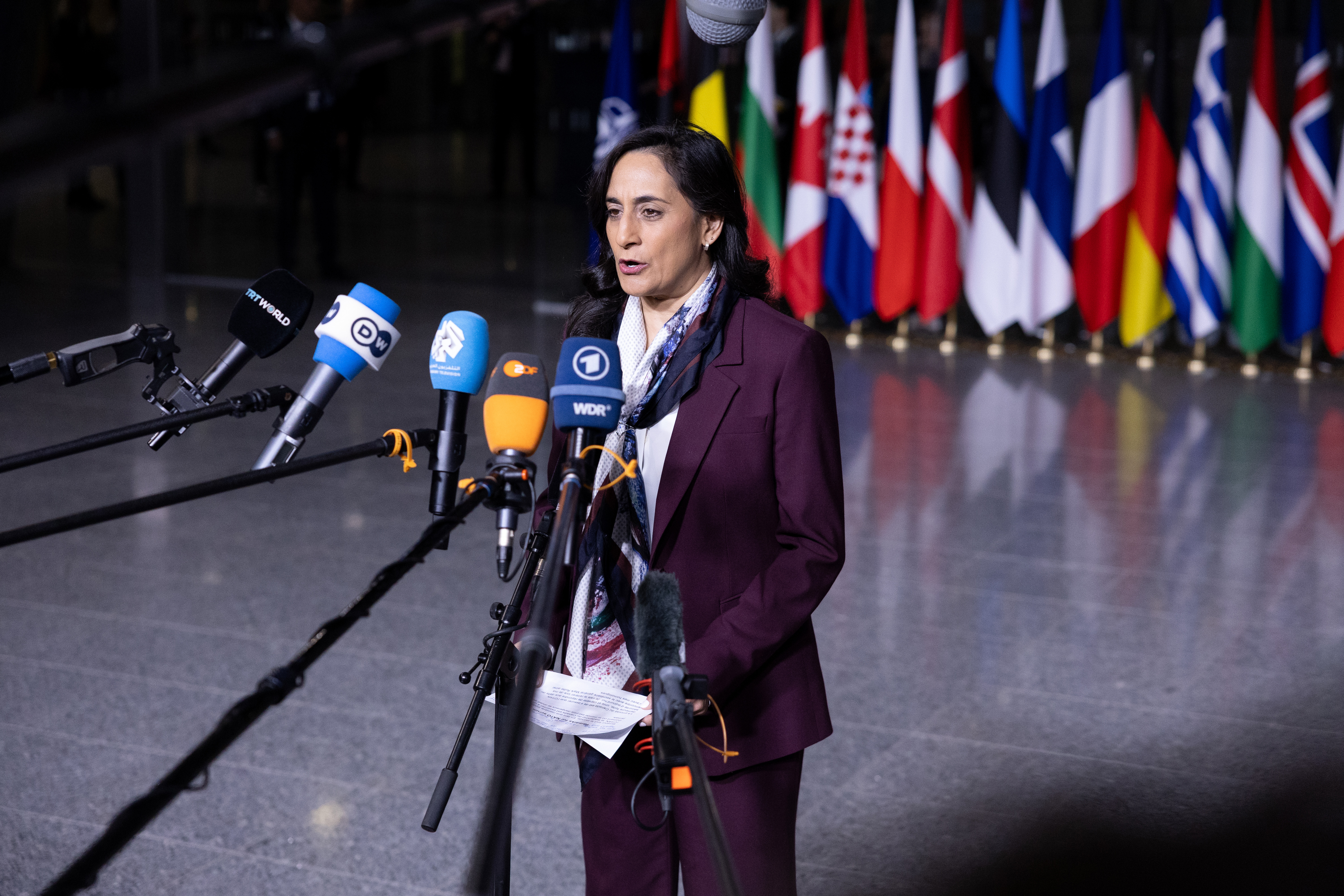 BRUSSELS, BELGIUM - DECEMBER 03: Anita Anand, Minister of Foreign Affairs of Canada, speaks to the press as she arrives at NATO headquarters for a NATO Foreign Affairs Ministers' meeting on December 03, 2025 in Brussels, Belgium. As part of the agenda for Wednesday's meeting of NATO Ministers of Foreign Affairs, the allies will hold a working lunch of the NATO-Ukraine Council. The meeting comes amid talks taking place in Moscow between a US envoy and Russian President Vladimir Putin, over the terms of a US-proposed peace deal to end Russia's war in Ukraine. (Photo by Omar Havana/Getty Images)