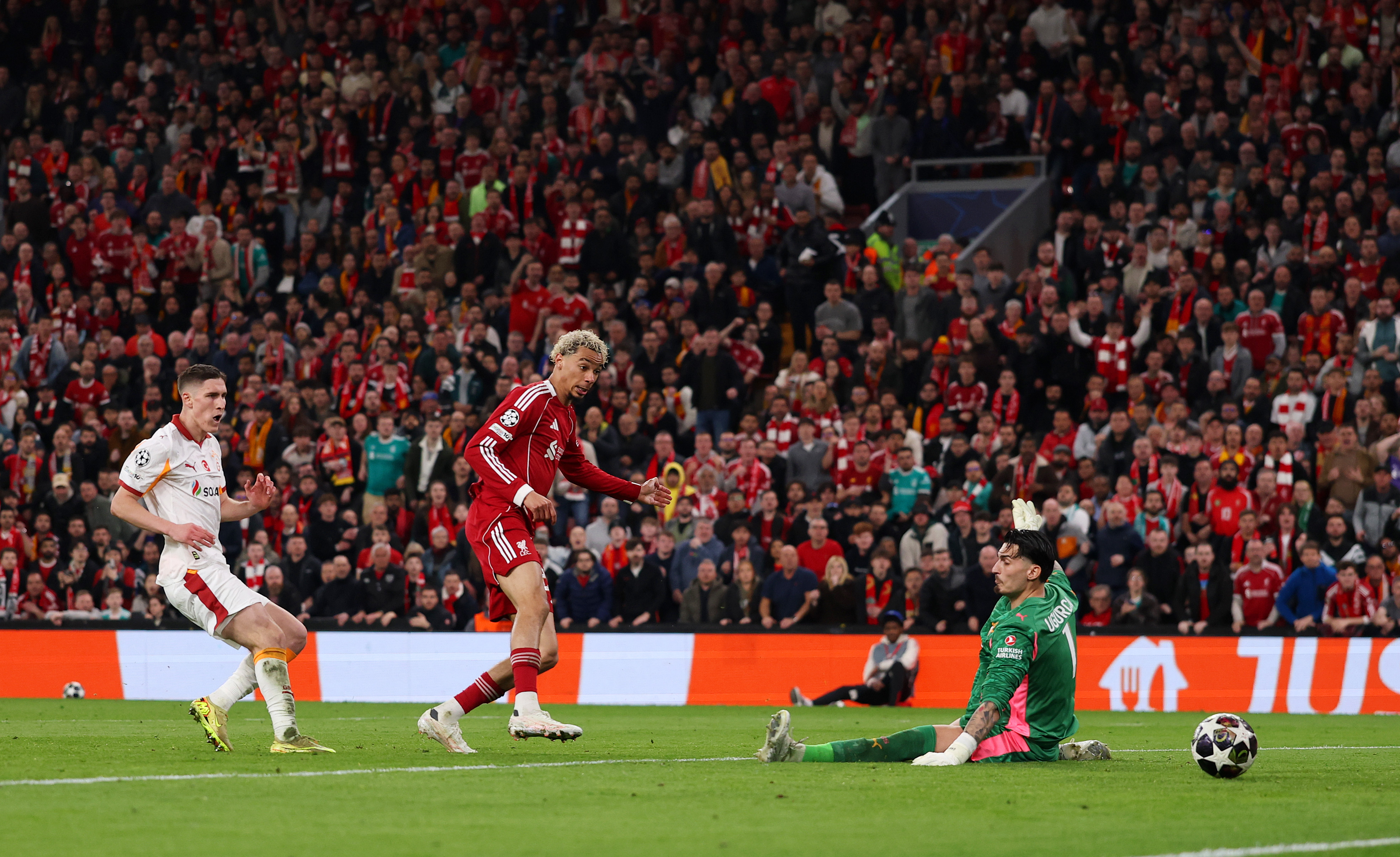 LIVERPOOL, ENGLAND - MARCH 18: Hugo Ekitike of Liverpool scores his team's second goal against Ugurcan Cakir of Galatasaray A.S. during the UEFA Champions League 2025/26 Round of 16 Second Leg match between Liverpool FC and Galatasaray SK at Anfield on March 18, 2026 in Liverpool, England. (Photo by Michael Regan/Getty Images)