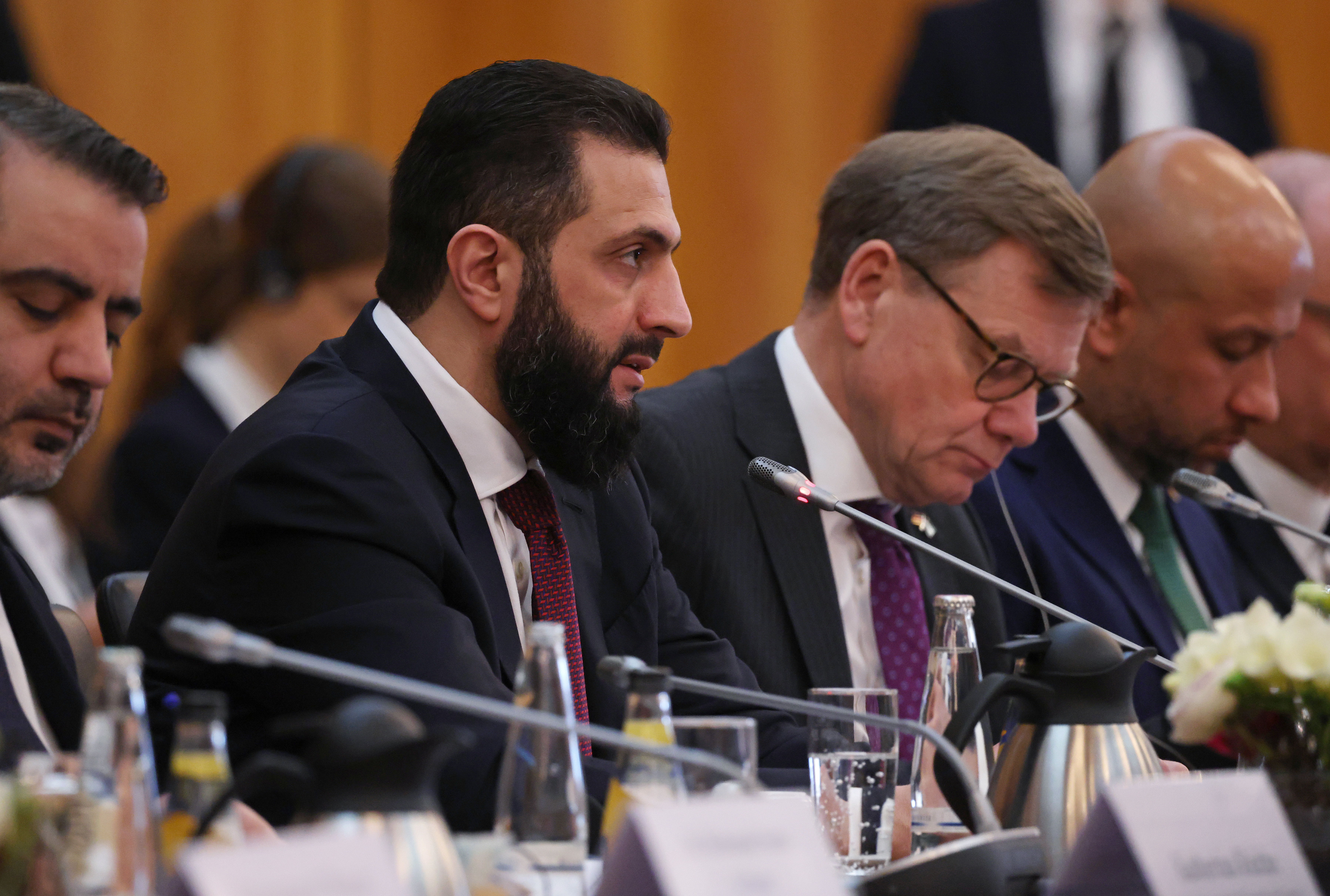 BERLIN, GERMANY - MARCH 30: Syrian President Ahmed al-Sharaa gives an opening statement as he sits with German Foreign Minister Johann Wadephul at a German-Syrian economic roundtable at the Foreign Ministry on March 30, 2026 in Berlin, Germany. Al-Sharaa is on his first visit to Berlin since taking office. He is meeting with German leaders and taking part in an economic round table. (Photo by Sean Gallup/Getty Images)