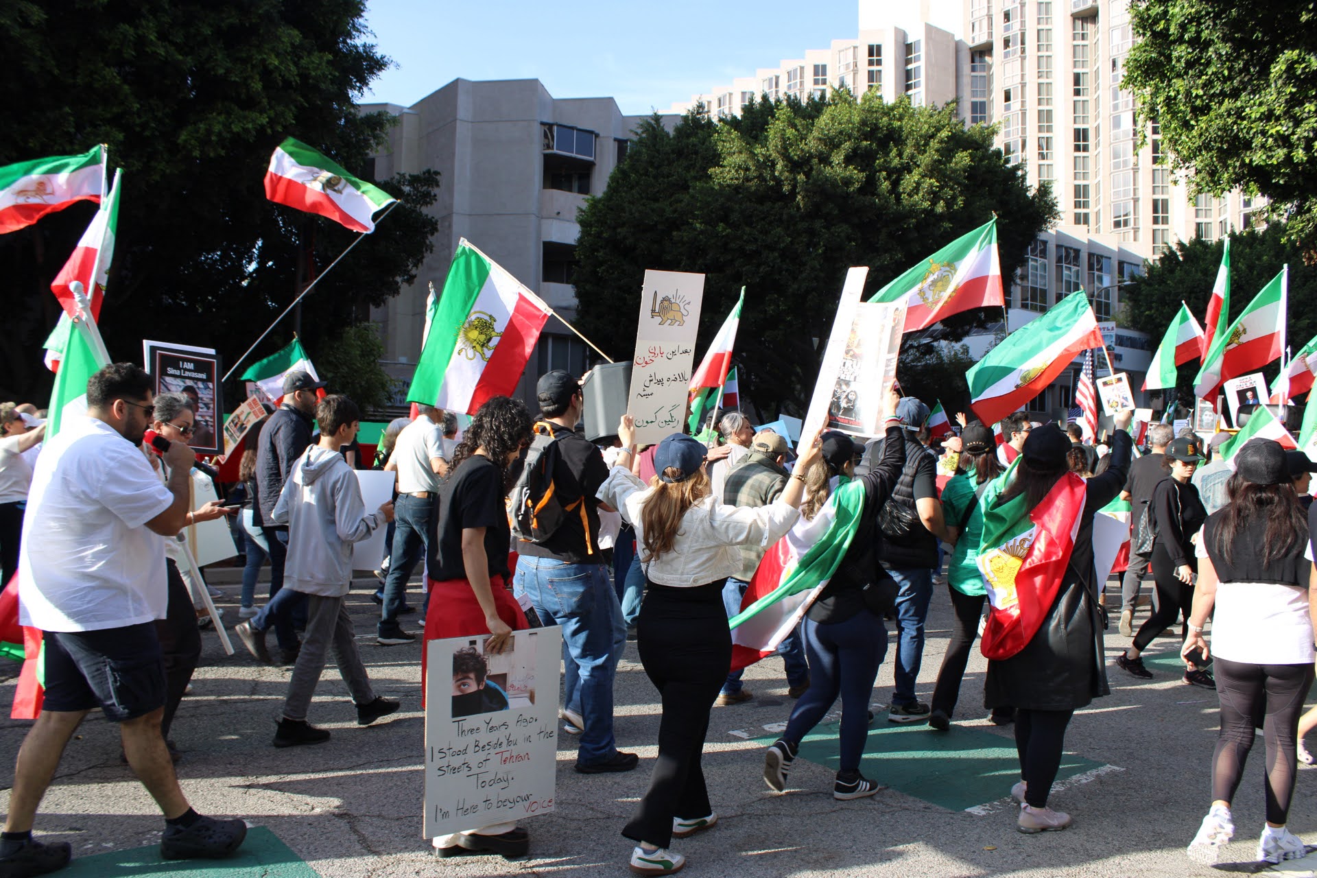Protesters march in Los Angeles waving flags for Iran's monarchy