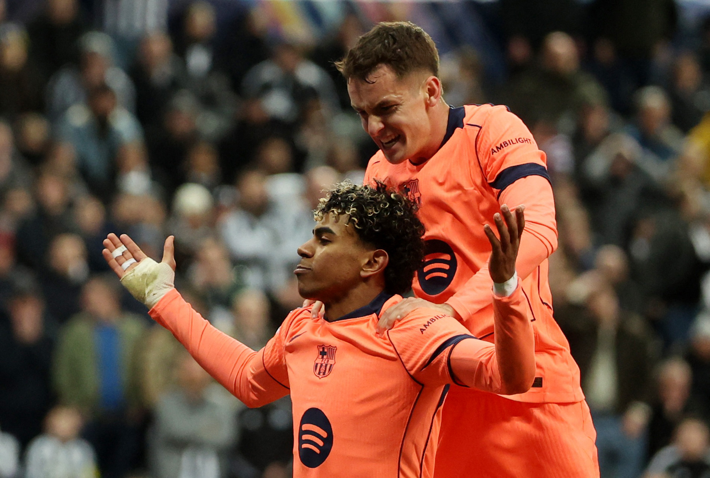 Soccer Football - UEFA Champions League - Round 16 - First Leg - Newcastle United v FC Barcelona - St James' Park, Newcastle, Britain - March 10, 2026 FC Barcelona's Lamine Yamal celebrates scoring their first goal with Marc Casado REUTERS/Scott Heppell
