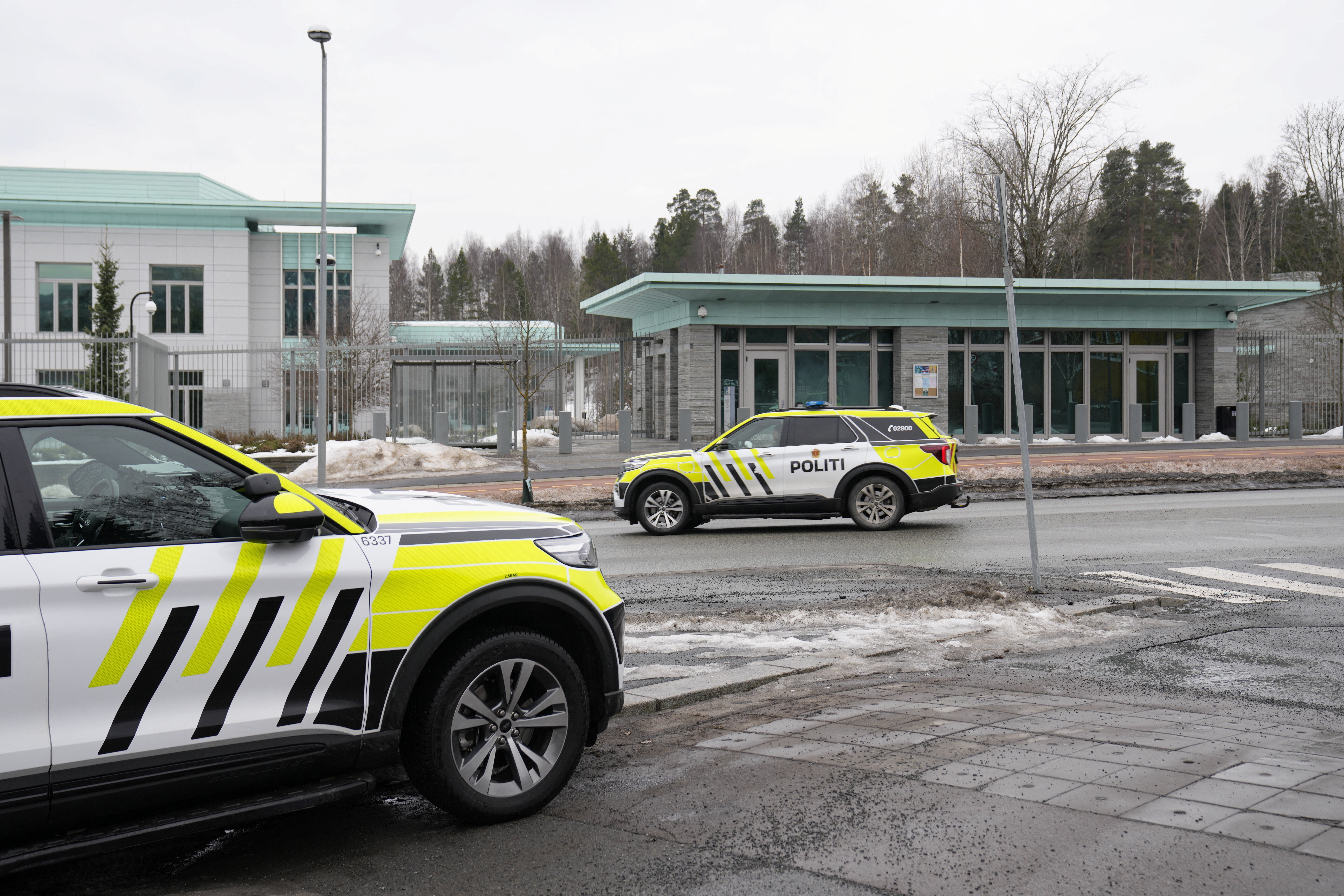 Police vehicles park outside the U.S. Embassy, after a loud bang was reported at the site, in Oslo, Norway, March 8, 2026. NTB/Fredrik Varfjell/via REUTERS ATTENTION EDITORS - THIS IMAGE WAS PROVIDED BY A THIRD PARTY. NORWAY OUT. NO COMMERCIAL OR EDITORIAL SALES IN NORWAY.
