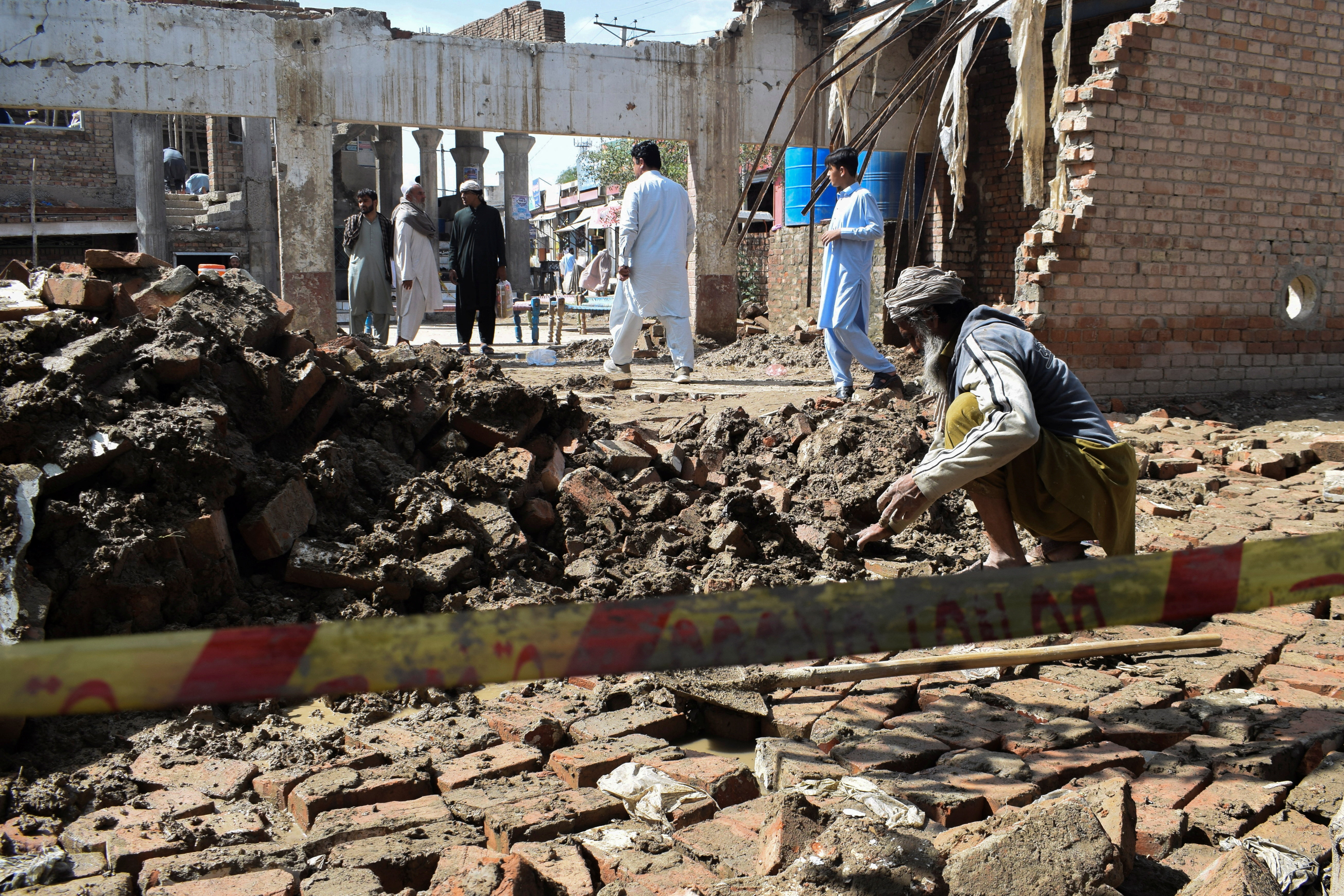 A man clears the rubble of his damaged house, collapsed after heavy rains in Bannu, Khyber Pakhtunkhwa province, in Pakistan March 30, 2026. REUTERS/Ehsan Khattak