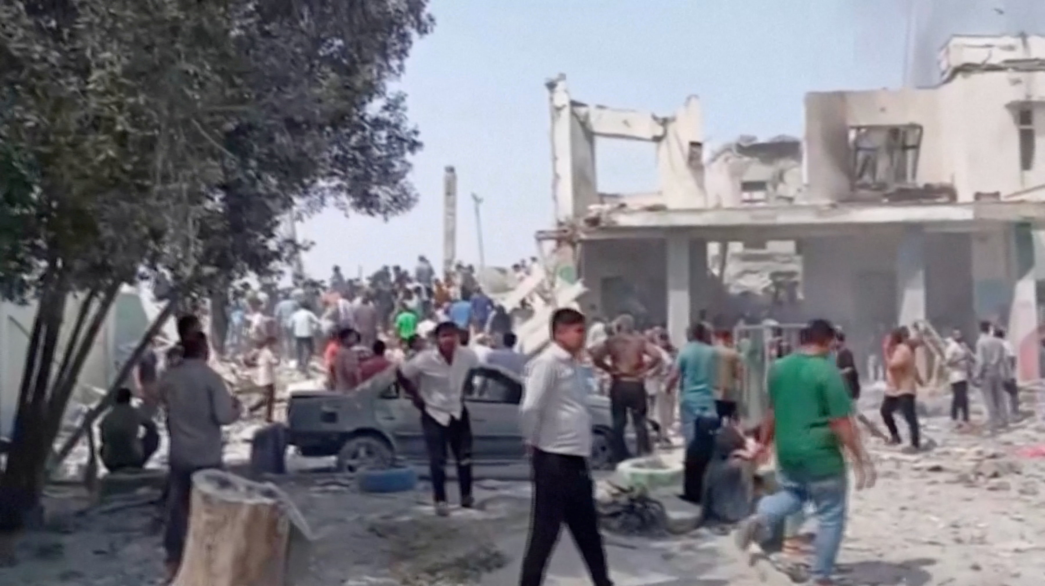 People gather at the site of a destroyed building at a school where several people were killed in a reported strike, amid the U.S.-Israeli conflict with Iran, in Minab, Iran in this screengrab obtained from a social media video released on February 28, 2026. Social Media/via Reuters TV/via REUTERS THIS IMAGE HAS BEEN SUPPLIED BY A THIRD PARTY. NO RESALES. NO ARCHIVES. NEWS USE ONLY. BEST QUALITY AVAILABLE. REFILE – REMOVING ATTRIBUTION TO STRIKE VERIFICATION: -Building, curb, road layout, wall, trees and utility pole matched satellite imagery -Coordinates: 27.109684199332207, 57.08493282609587 -Exact date not verified, but no earlier version of the videos was found posted online before February 28 -Iranian state media reported on February 28 that Israel struck a school in southern Iran, resulting in 40 deaths. -The website of the school has an address that matches the coordinates