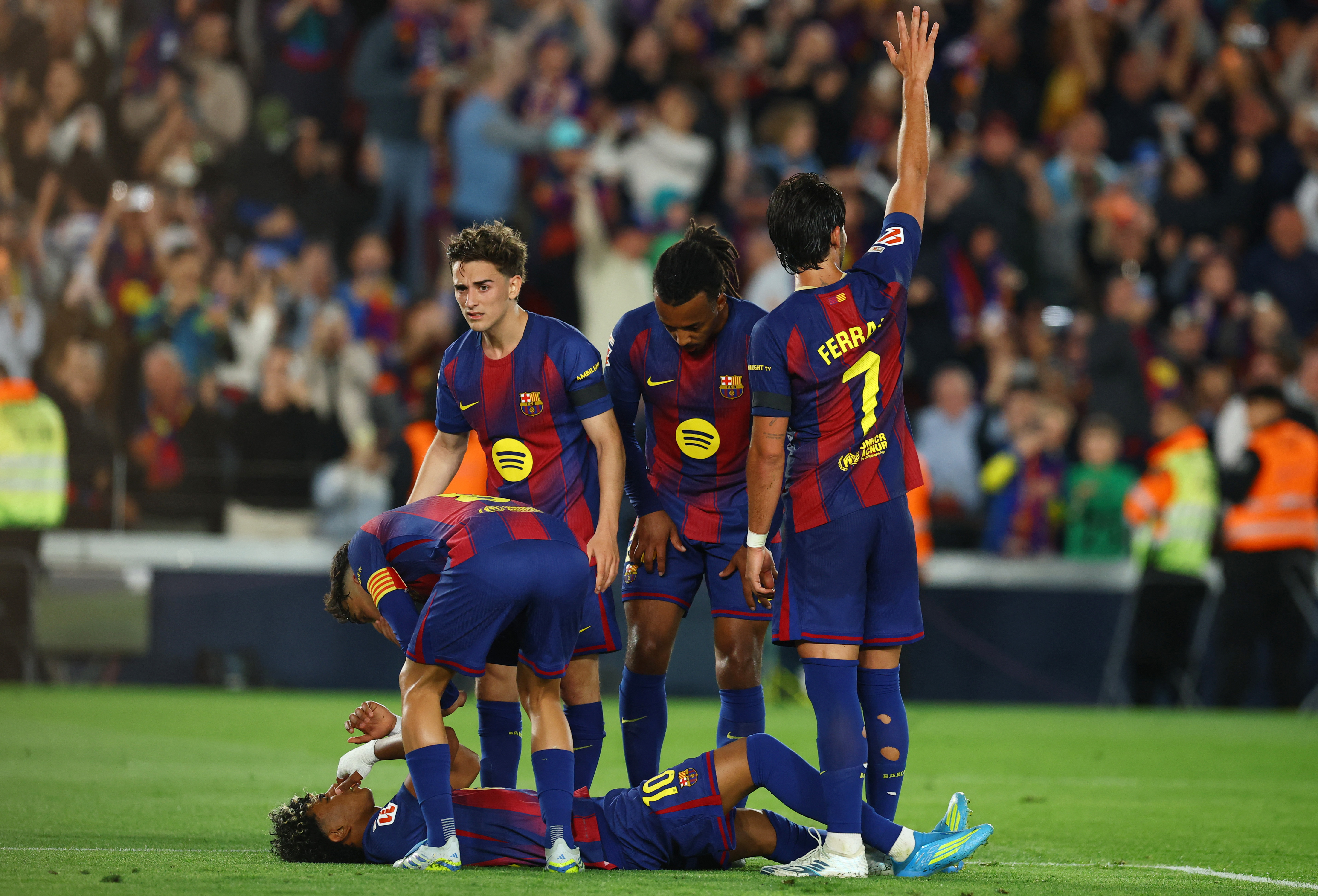 Barcelona’s Lamine Yamal reacts to the injury sustained when taking the penalty