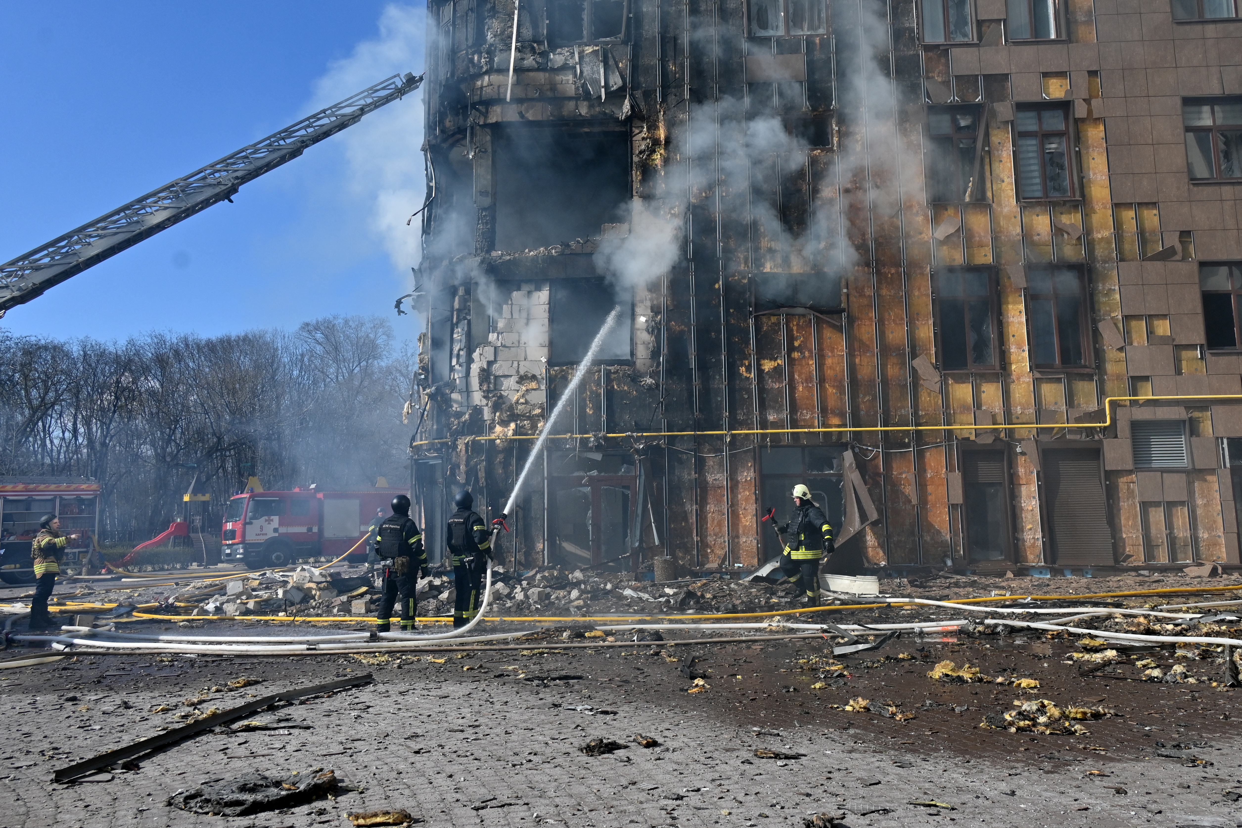 Ukrainian rescuers work to extinguish a fire in a damaged residential building following a drone attack in Kharkiv on April 2, 2026, amid the Russian invasion of Ukraine.