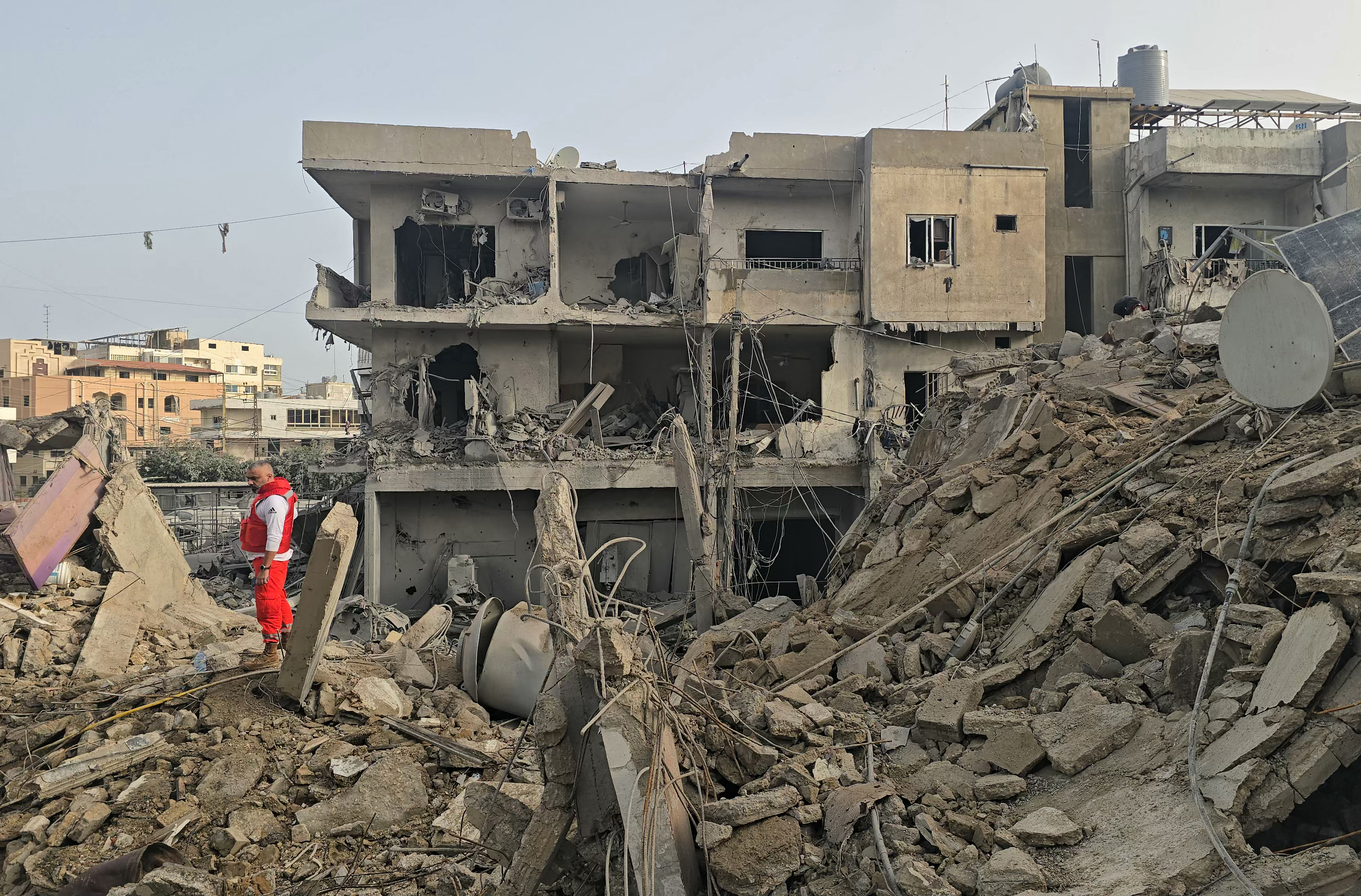 A rescue worker inspects the debris of destroyed buildings at the site of an Israeli strike in the southern Lebanese area of Maarakeh near the coastal city of Tyre on April 4, 2026.