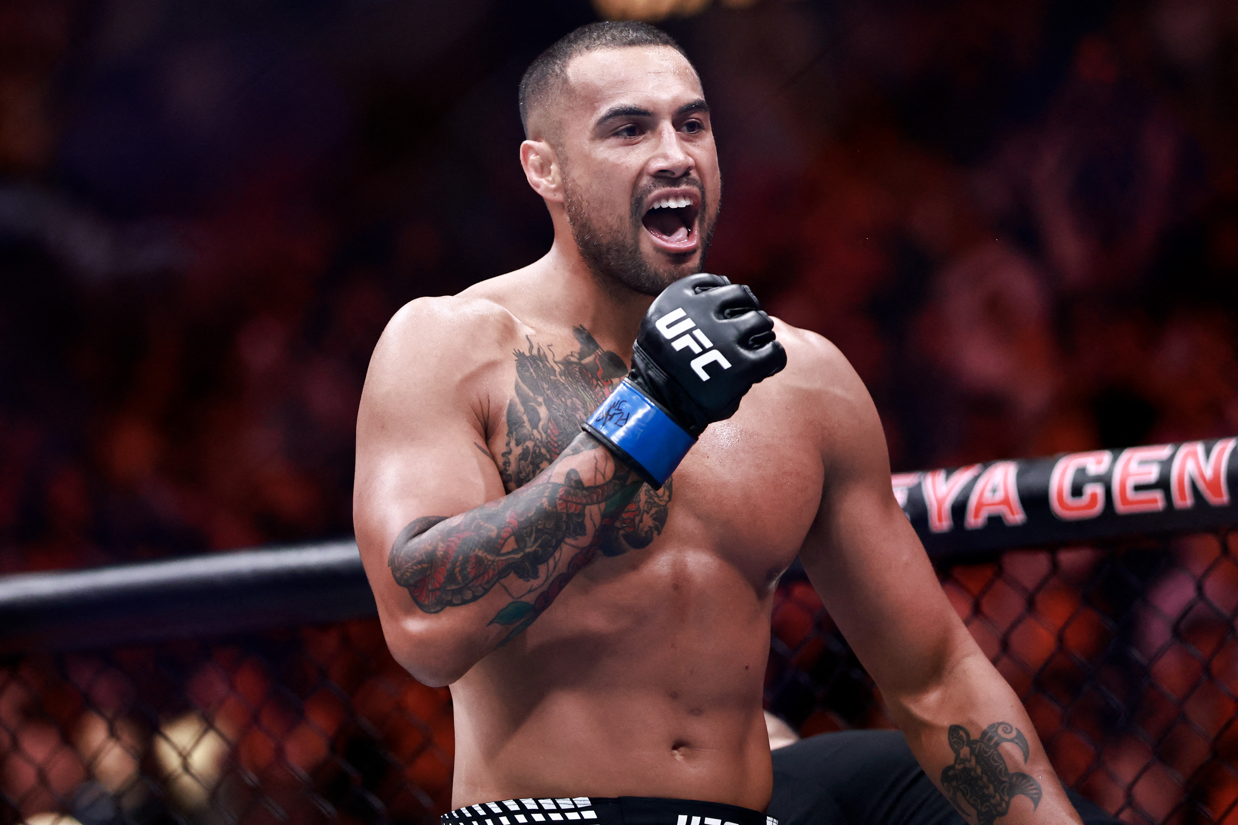 Carlos Ulberg of New Zealand celebrates after his victory over Jiri Prochazka of Czechia in a light heavyweight title bout during UFC 327