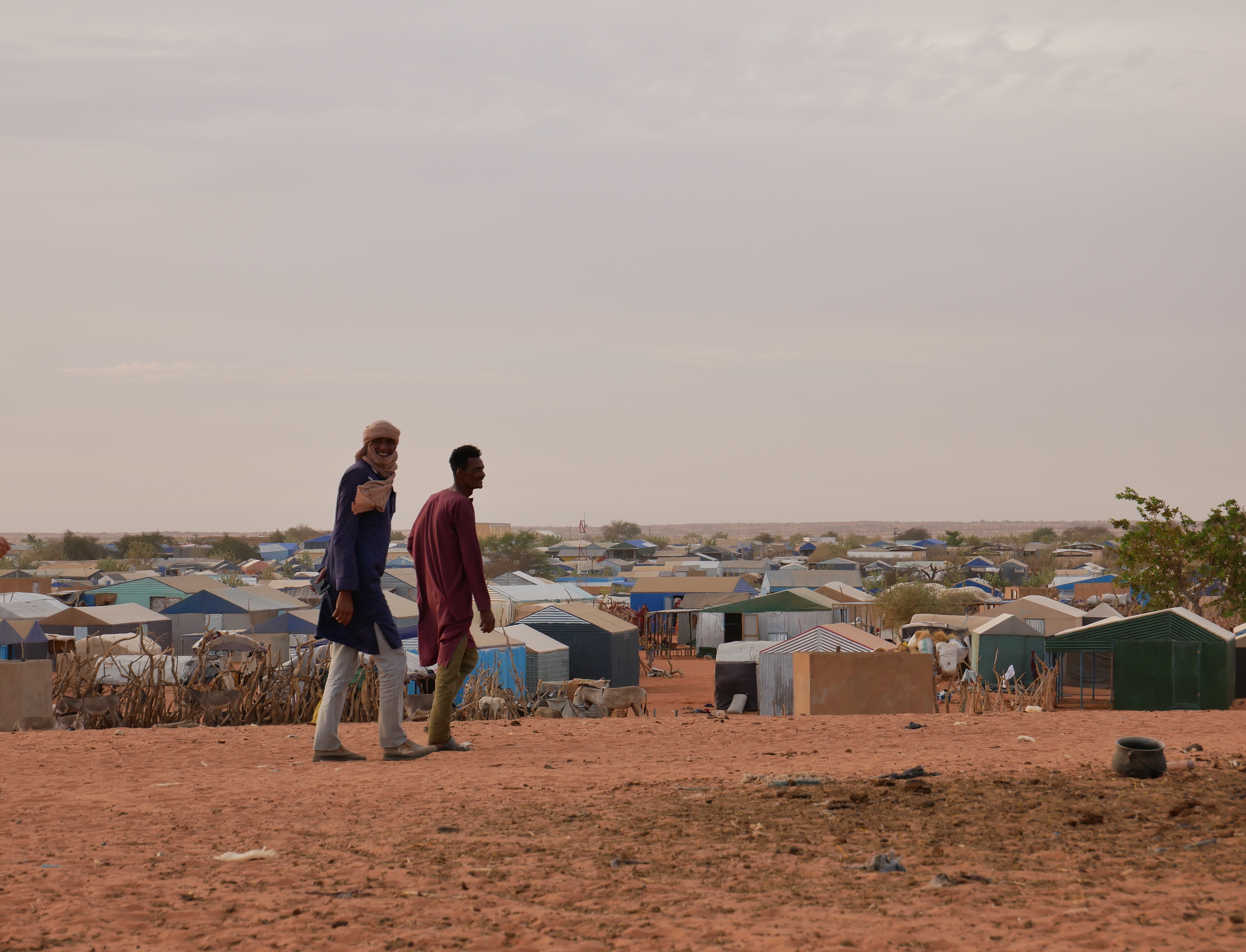 Refugees walk in Mbera camp in Mauritania, where hundreds of thousands of Malians displaced in 2012 and since 2023 live