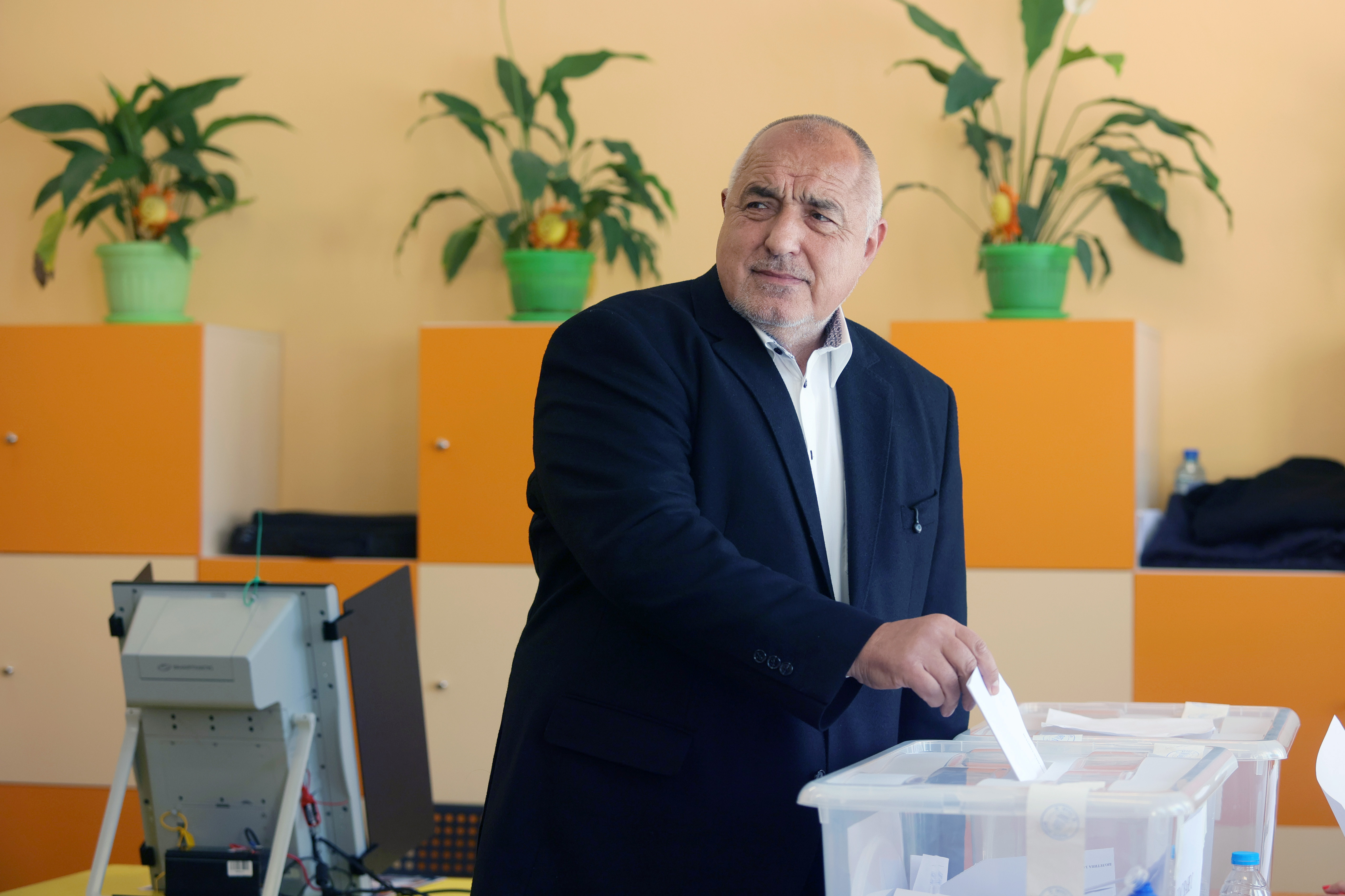 Former Prime Minister Boyko Borissov casts his vote in a polling station in Bankya, Bulgaria, Sunday, April 19, 2026, during early parliamentary elections. (AP Photo/Valentina Petrova)