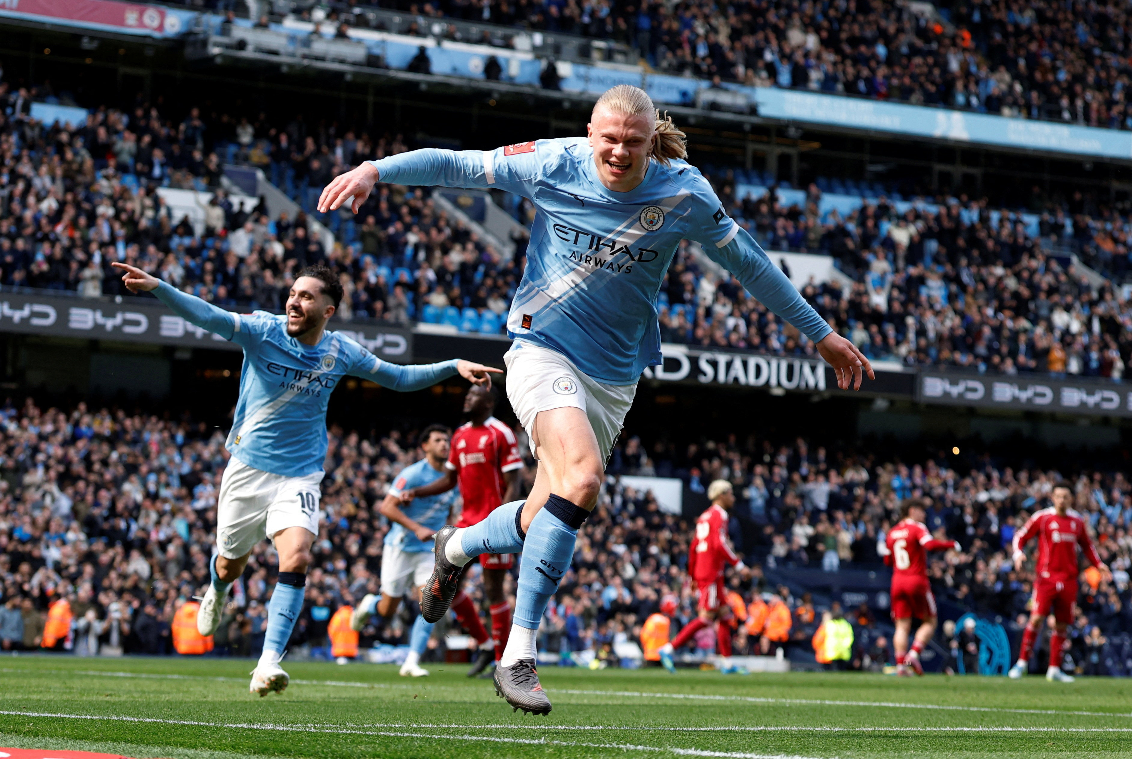 Soccer Football - FA Cup - Quarter Final - Manchester City v Liverpool - Etihad Stadium, Manchester, Britain - April 4, 2026 Manchester City's Erling Haaland celebrates scoring their first goal with Rayan Cherki Action Images via Reuters/Jason Cairnduff TPX IMAGES OF THE DAY