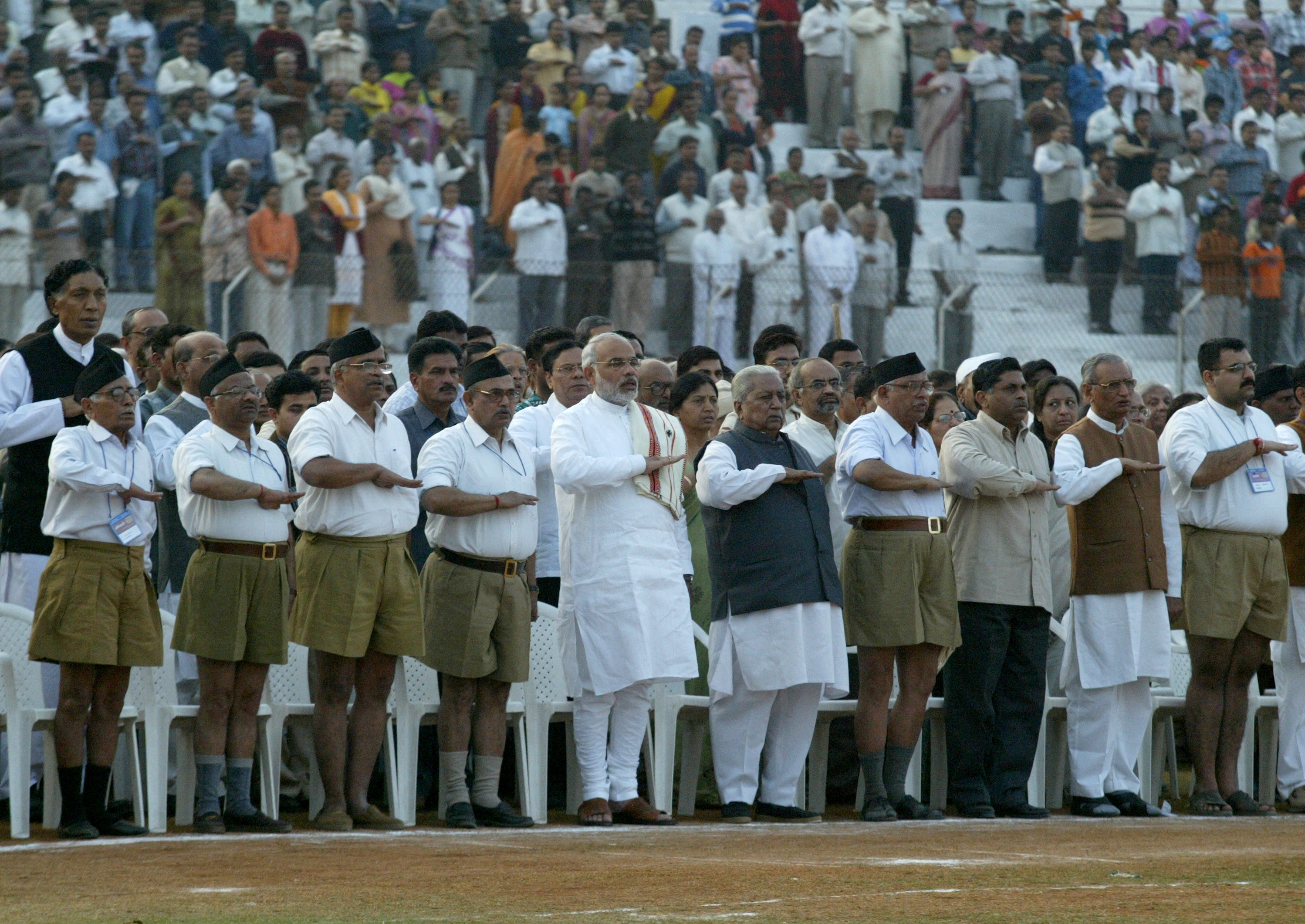 Narendra Modi and others perform a salute.