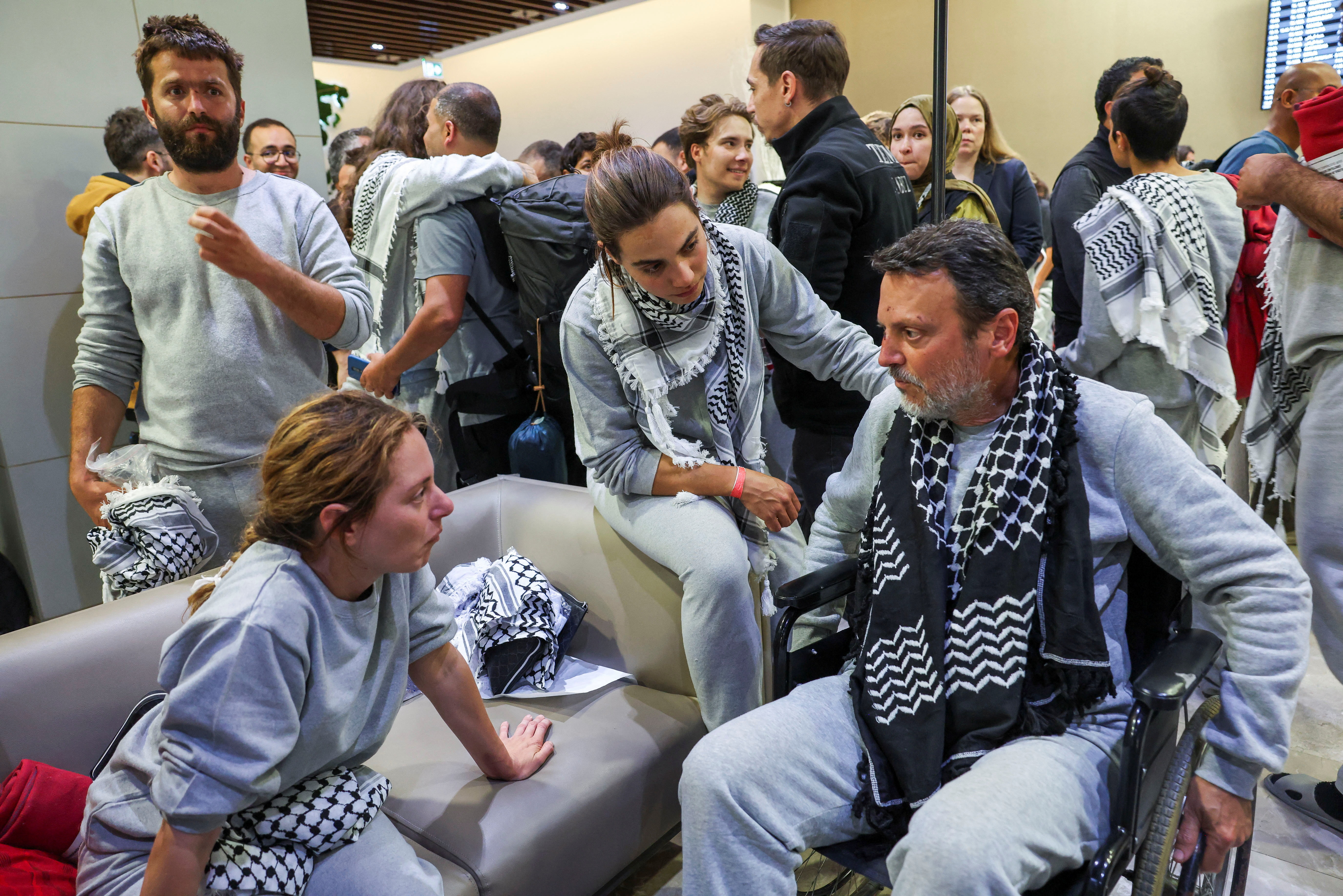 Greek activists from the Gaza-bound Global Sumud Flotilla, detained by Israeli forces after their vessels were intercepted in international waters in the Mediterranean, speak upon arrival at Istanbul Airport, Turkey, May 21, 2026. REUTERS/Murad Sezer