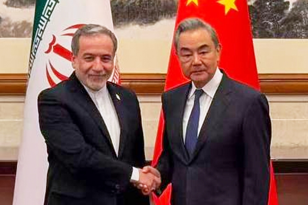 In this photo released by the Telegram channel of Iranian Foreign Minister Abbas Araghchi, China's Foreign Minister Wang Yi, right, meets with Iran's Foreign Minister Abbas Araghchi in Beijing, China, Wednesday, May 6, 2026. (Telegram channel of the Iranian Foreign Minister via AP)
