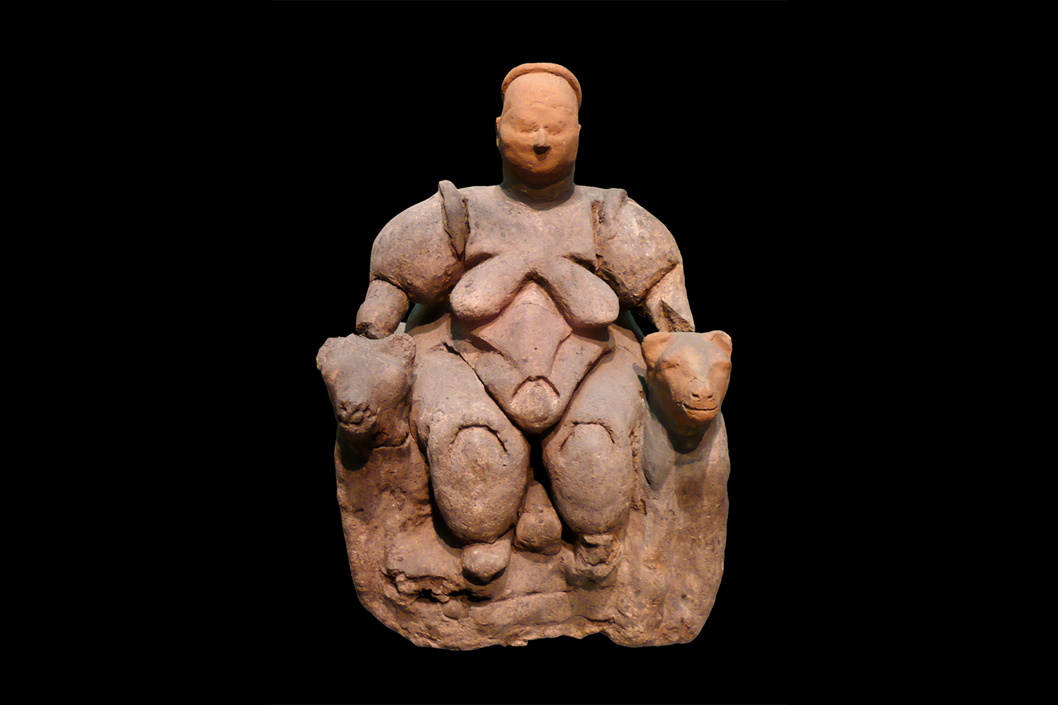 The Seated Woman of Catalhoyuk sits dominantly between two leopards, holding her seat [Creative Commons]