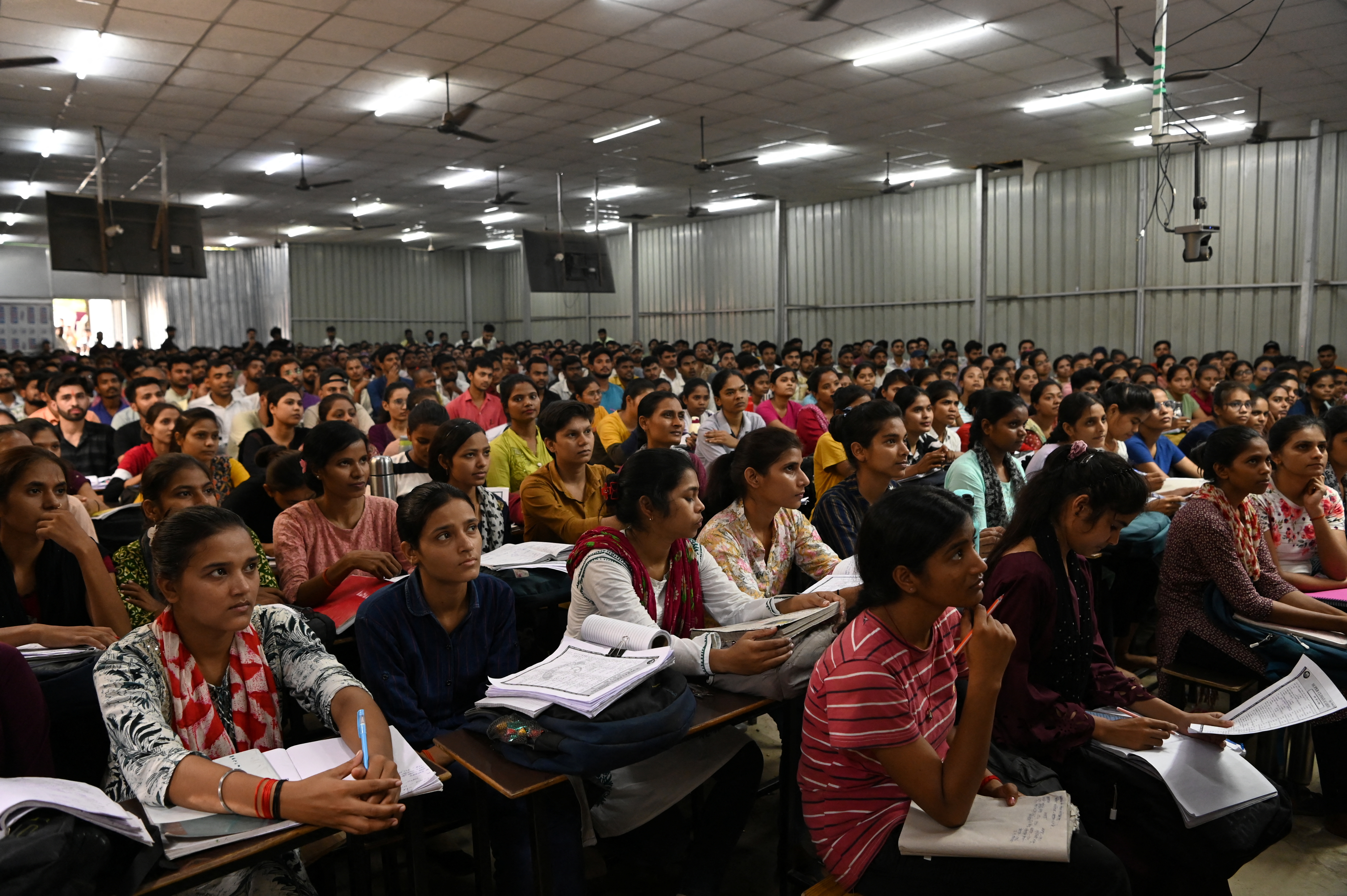 Students attend a class at Super Climax Academy, a coaching institute training students to secure government jobs, in Prayagraj, India, June 19, 2024