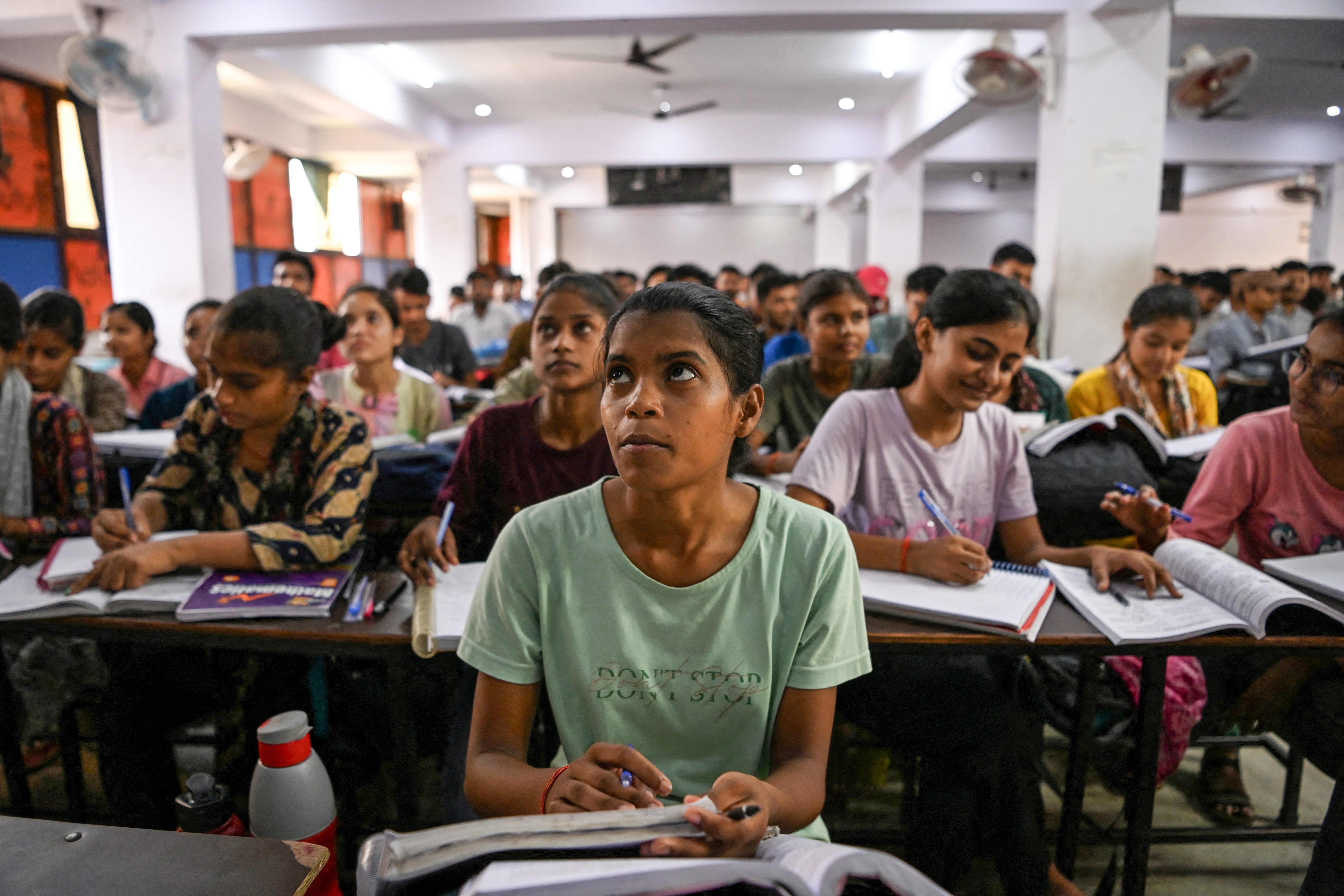 Students attend a class at Super Climax Academy, a coaching institute training students to prepare for competitive examinations to secure government jobs, in Prayagraj, India, June 21, 2024 [Sahiba Chawdhary/Reuters]