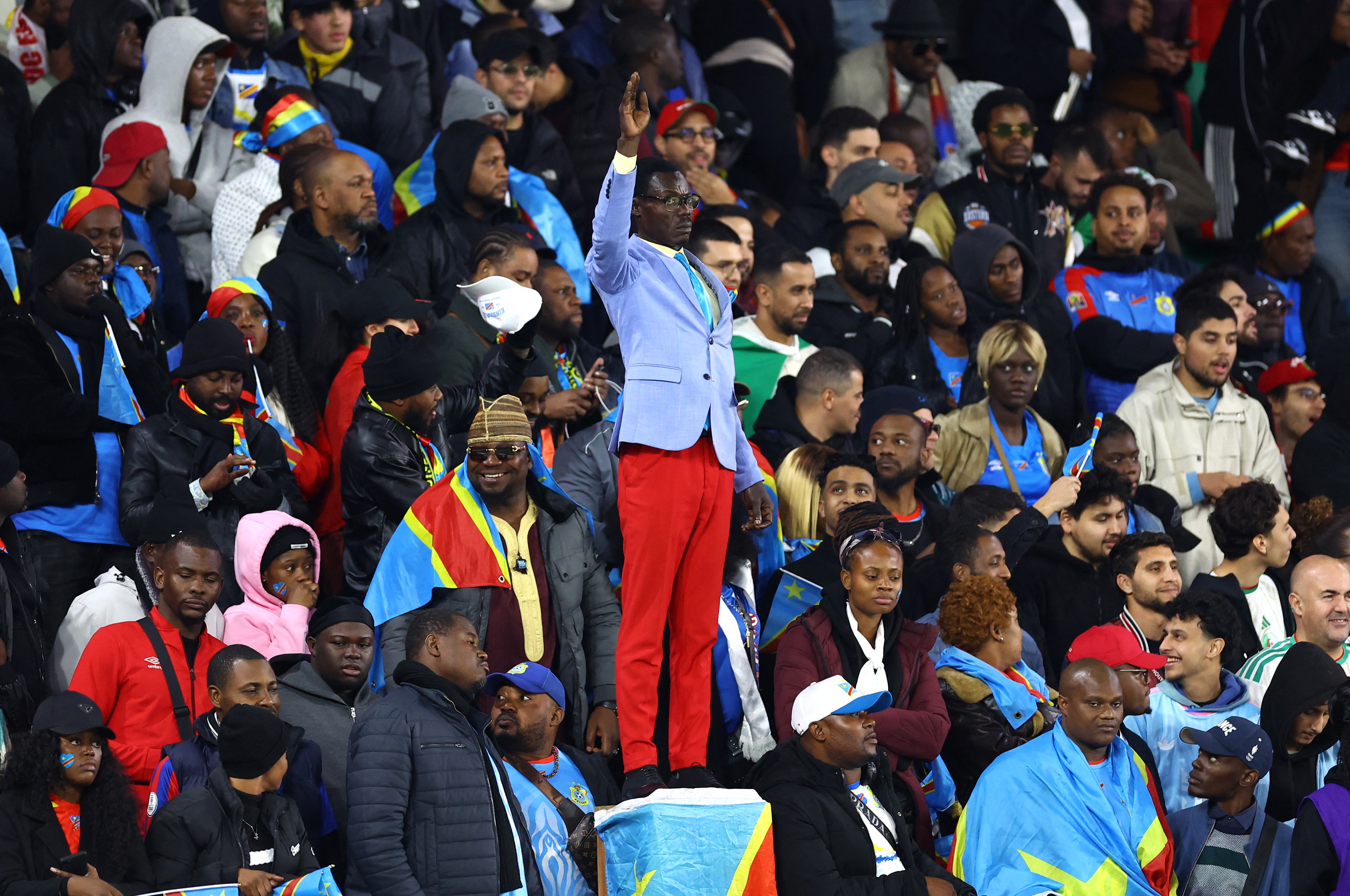 DR Congo super fan Michel Nkuka Mboladinga poses as a statue of the country’s independence hero Patrice Lumumba during the AFCON defeat to Algeria in Morocco in January