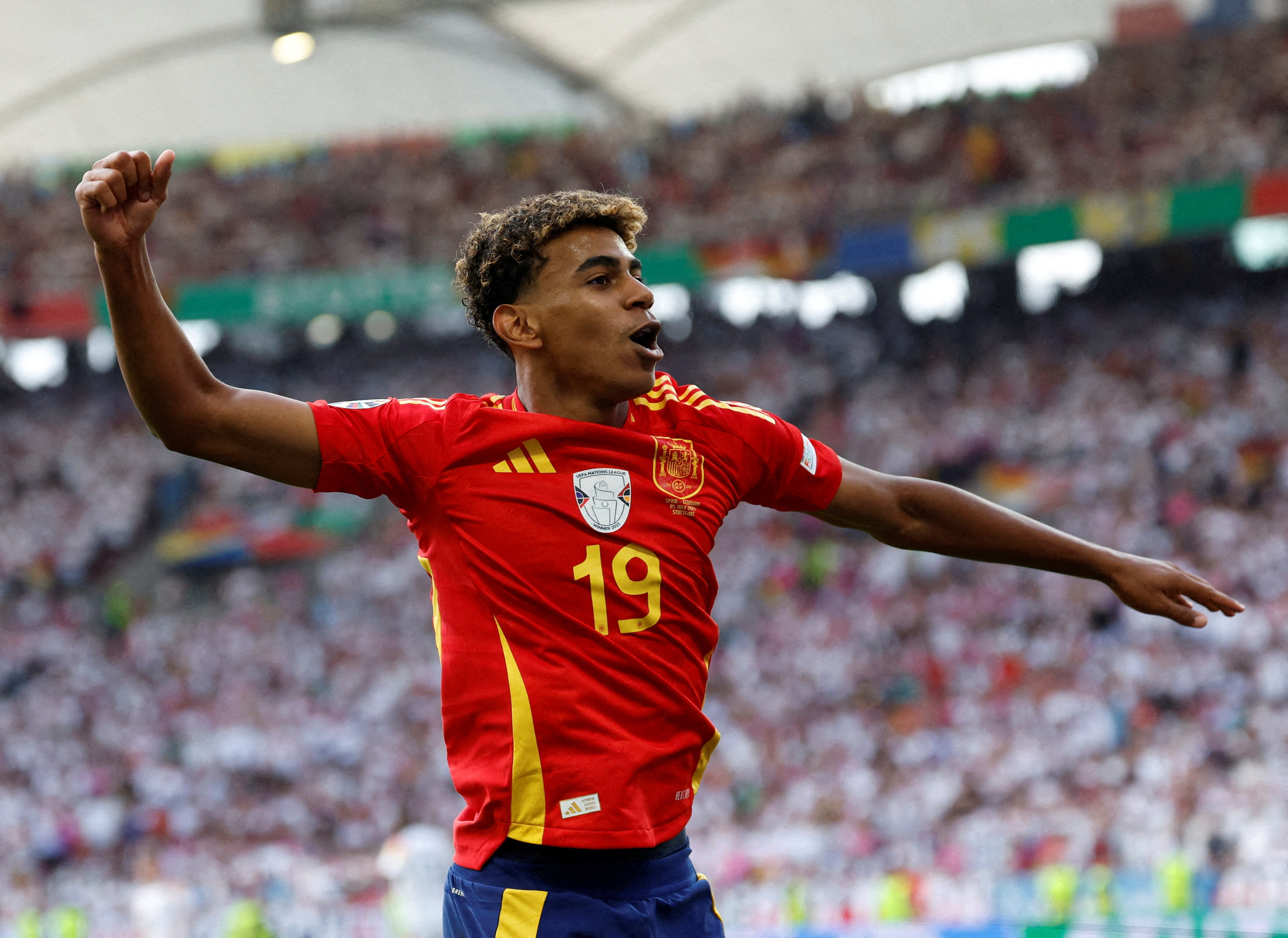 Spain's Lamine Yamal celebrates after Dani Olmo scores their first goal