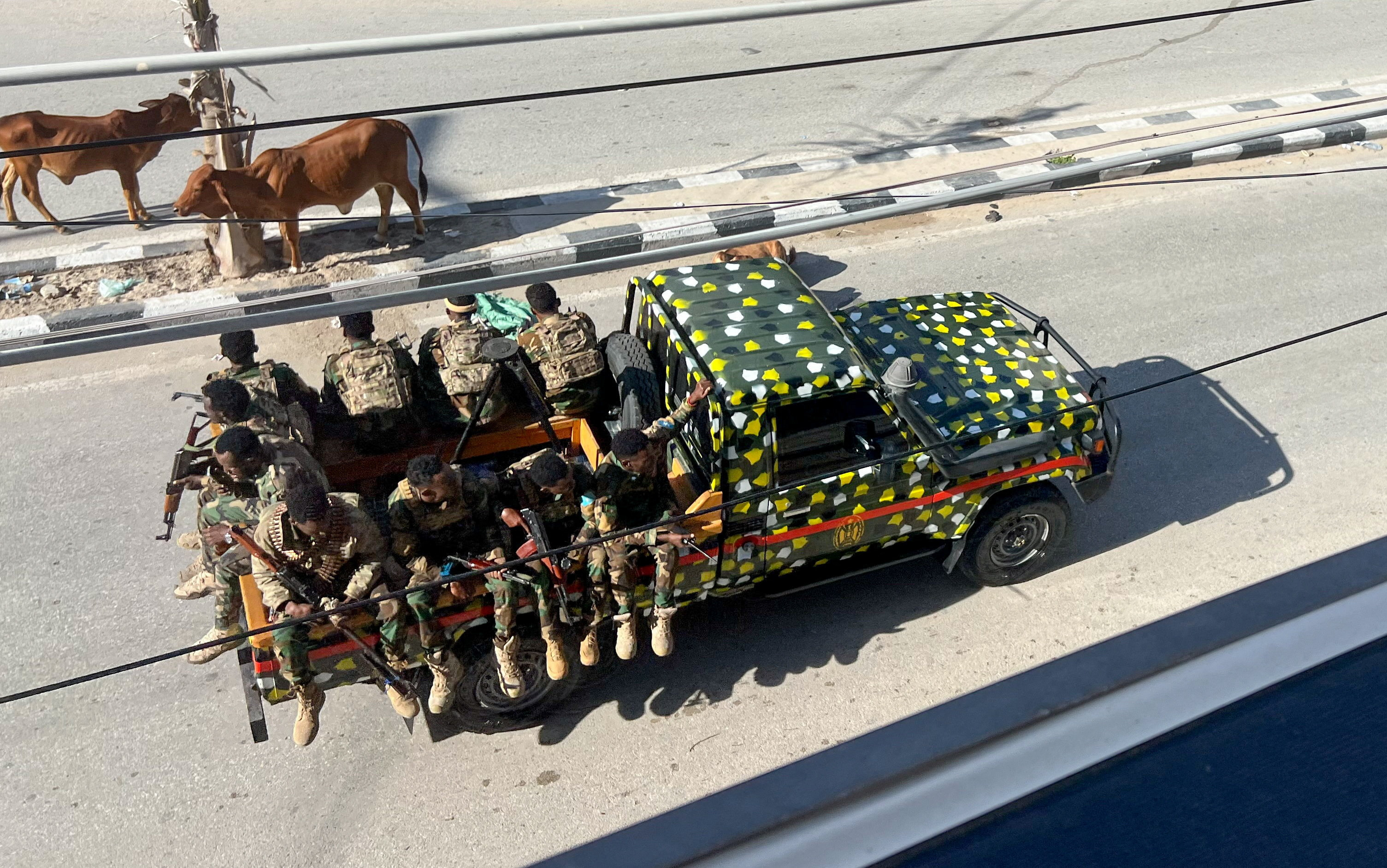 A truck carrying Somali security forces drives on a road ahead of a planned protest