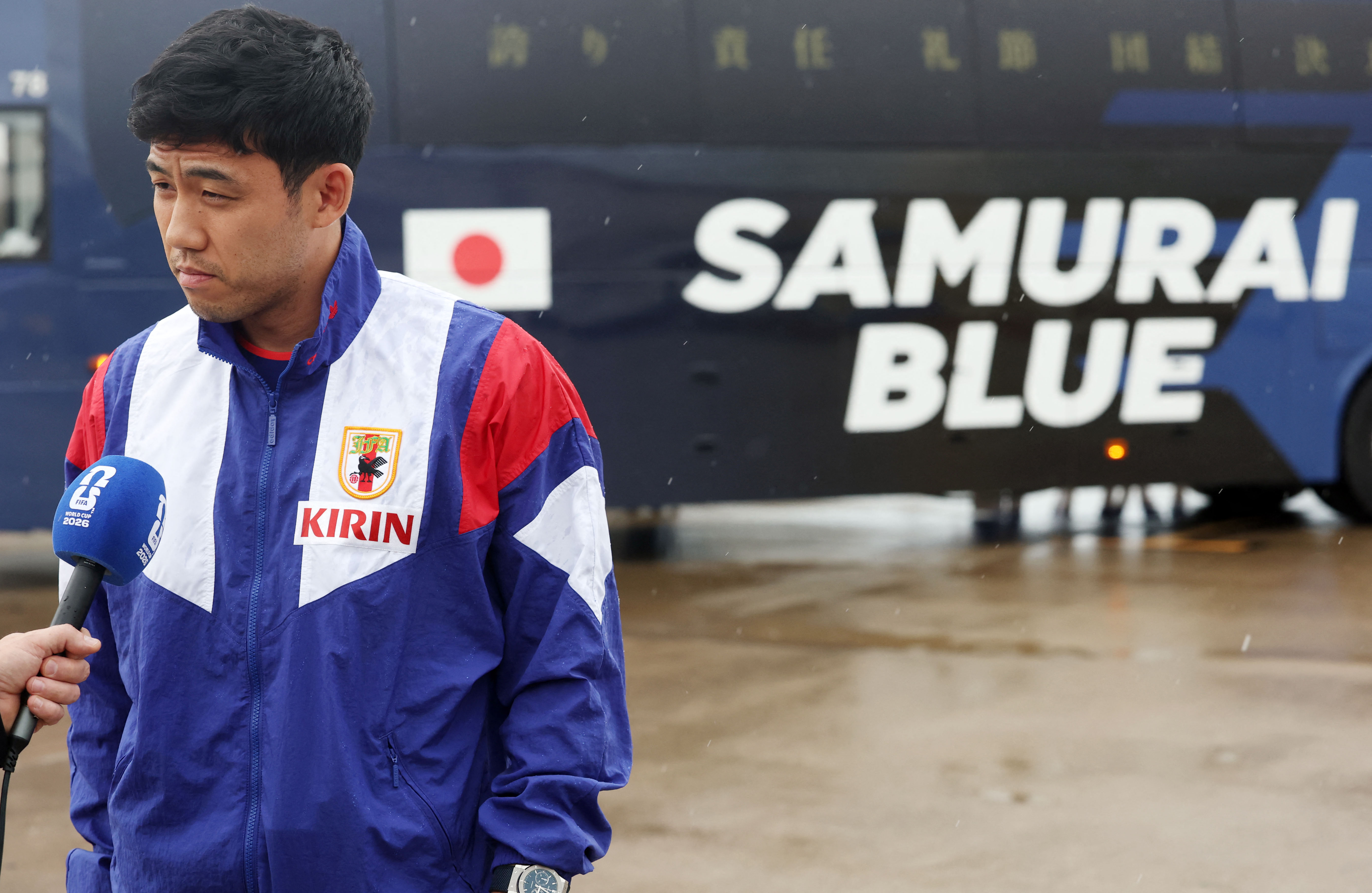 Jun 8, 2026; Nashville, Tennessee, USA; Wataru Endo of Japan is interviewed after arriving for the 2026 FIFA World Cup at Nashville International Airport. Mandatory Credit: Alan Poizner-Imagn Images