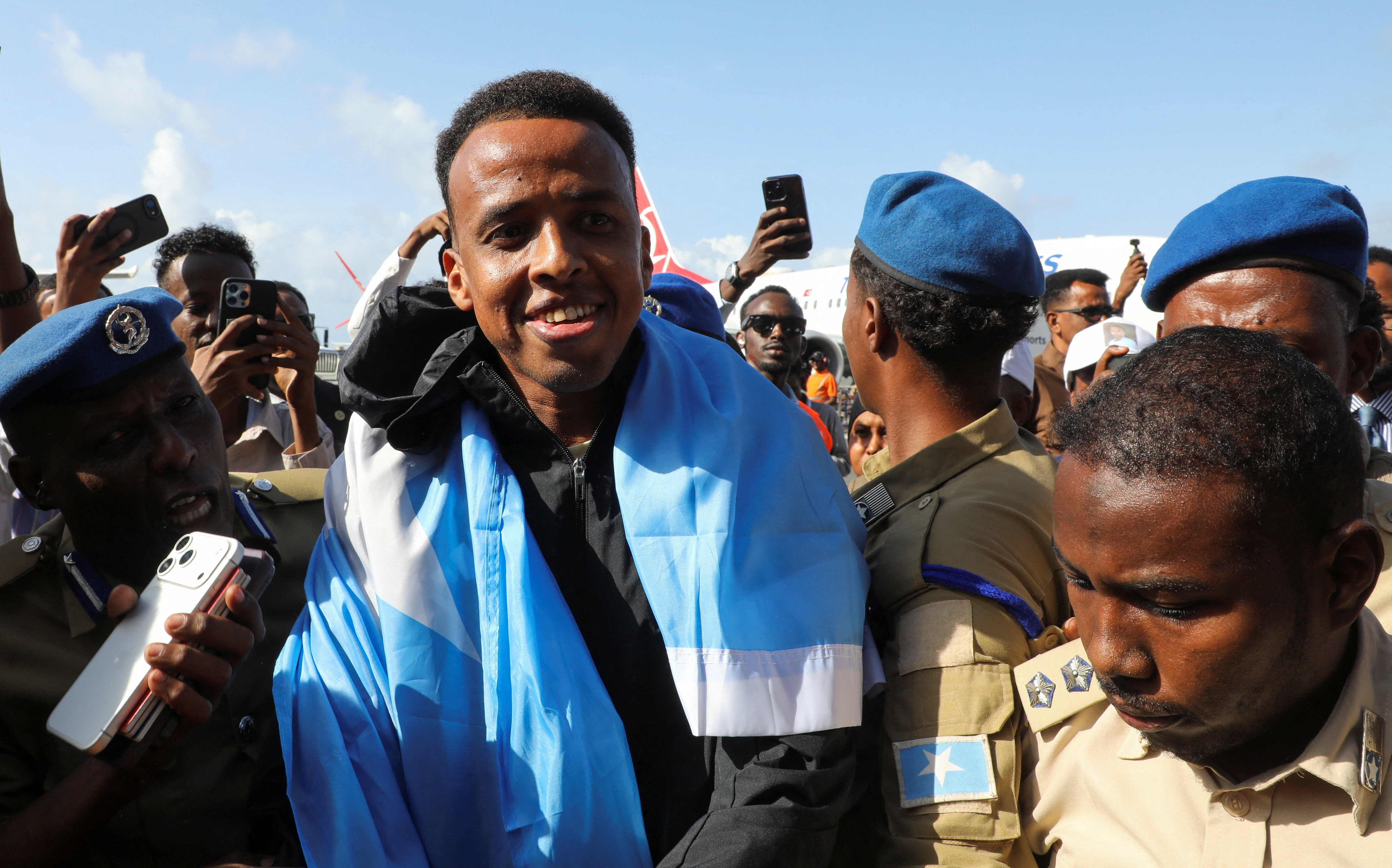 Somali referee Omar Abdulkadir Artan, who had been expected to officiate at matches during the 2026 FIFA World Cup but was denied entry to the United States, is received as he arrives at the Aden Abdulle Osman International Airport in Mogadishu, Somalia June 10, 2026. REUTERS/Feisal Omar